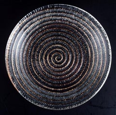 Murano, Italy, four small plates in clear glass with spiral-shaped decoration.