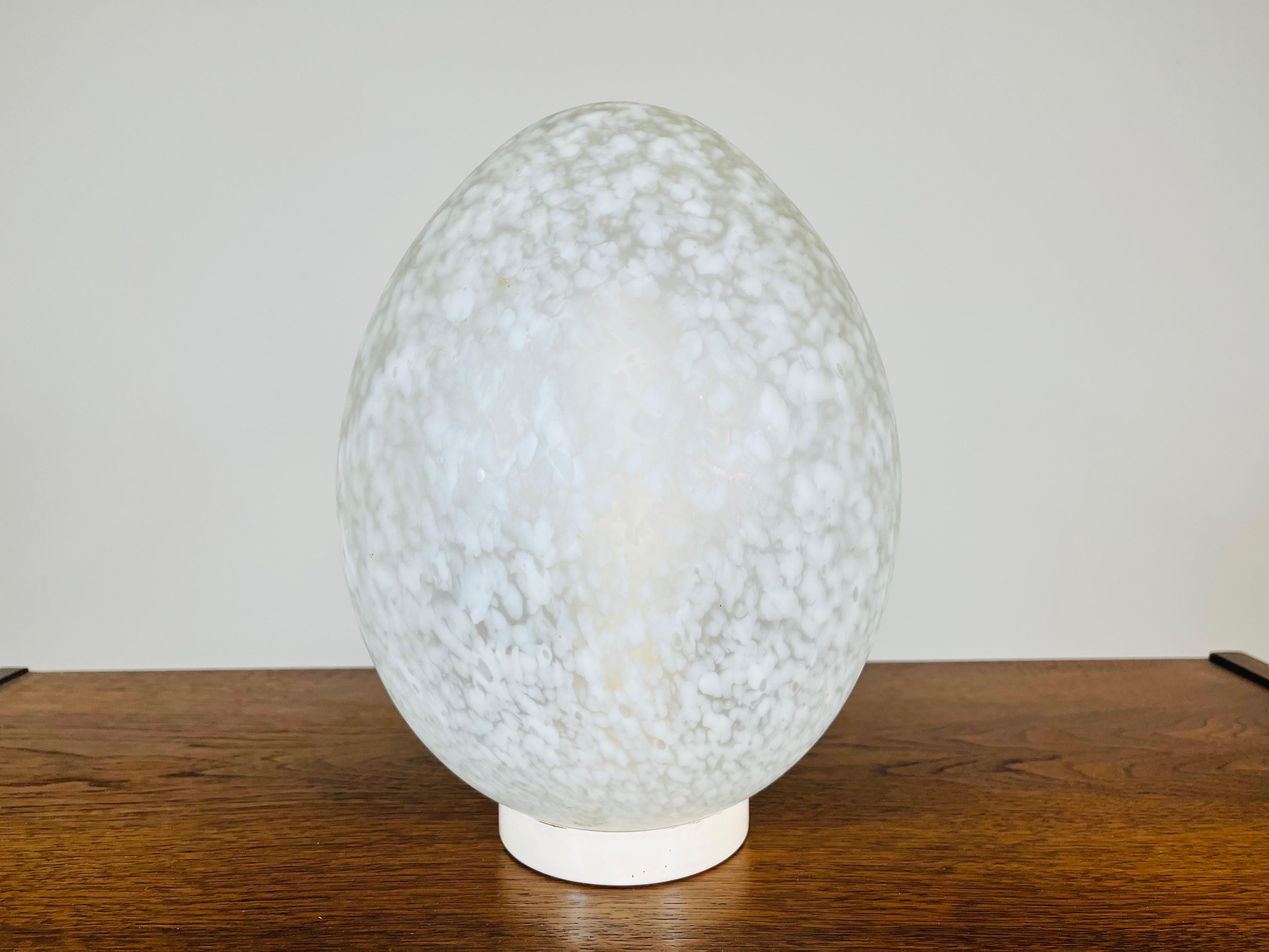 Mid-century hand-blown egg table lamp by Murano having safe, functional cord and bulb rig housed in a blown glass egg from Murano, Italy created in 1968. 
 Outstanding vintage condition, having been well maintained and procured by the original