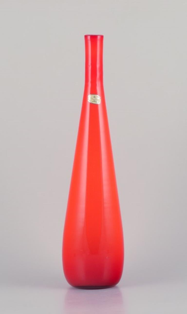 Murano, Italy. 
Large art glass vase with a slender neck in orange mouth-blown glass.
1960/70s.
Label.
Perfect condition.
Dimensions: H 53.0 cm x D 12.0 cm.