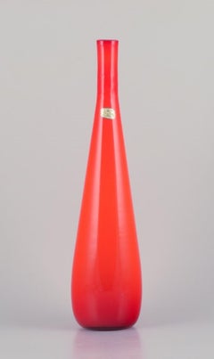 Murano, Italy. Large art glass vase with a slender neck in orange glass.