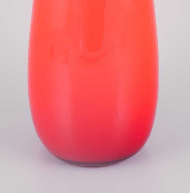 Mid-20th Century Murano, Italy. Large art glass vase with a slender neck in orange glass. For Sale