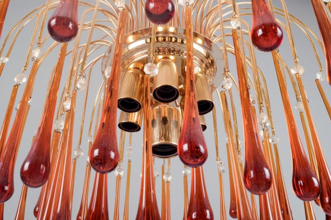 Mid-20th Century Murano, Italy. Large ceiling lamp in amber art glass, with brass frame. For Sale