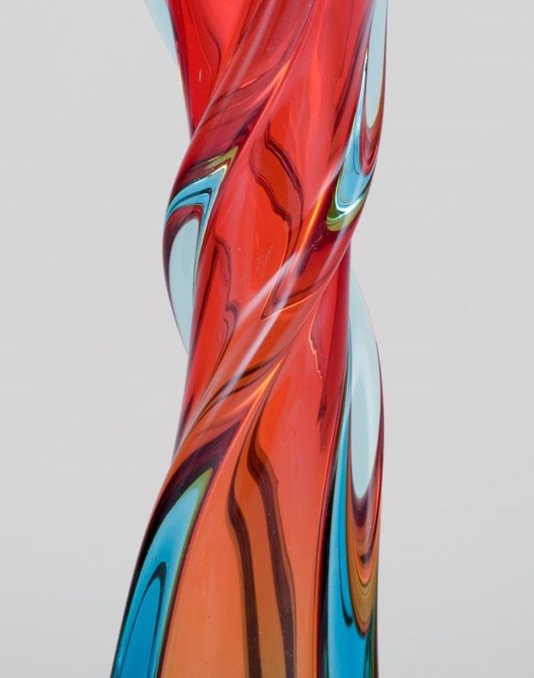 Italian Murano, Italy, large mouth-blown and twisted art glass vase in blue and red.