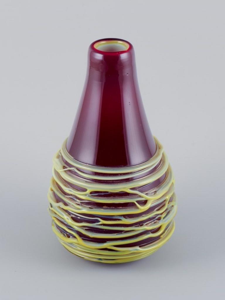 Modern Murano, Italy, large mouth-blown spaghetti vase in burgundy art glass. 1970s. For Sale