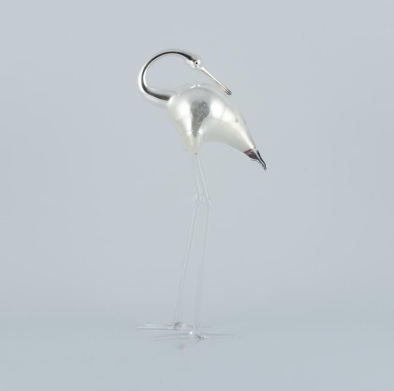 Murano, Italy. A pair of rare art glass sculptures in mouth-blown glass with silver decoration. 
Shaped like standing cranes.
Mid-20th century.
In excellent condition with signs of use.
Dimensions: Tallest 35.0 cm x D 16.0 cm.