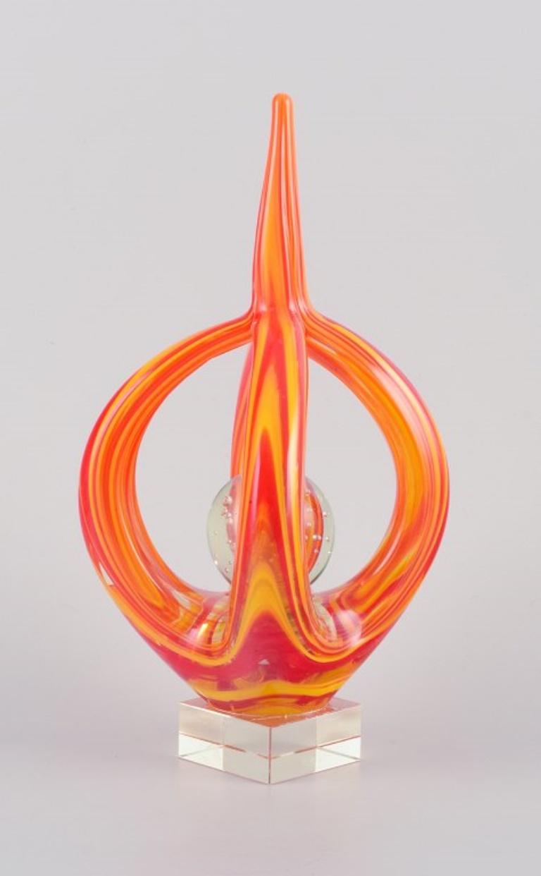 Murano, Italy, sculpture in hand-blown colored glass.
Modernist design. Art glass in yellow and orange, ball in clear glass with inner air bubbles.
1970s
In perfect condition.
Dimensions: H 27.3 cm x D 12.0 cm.