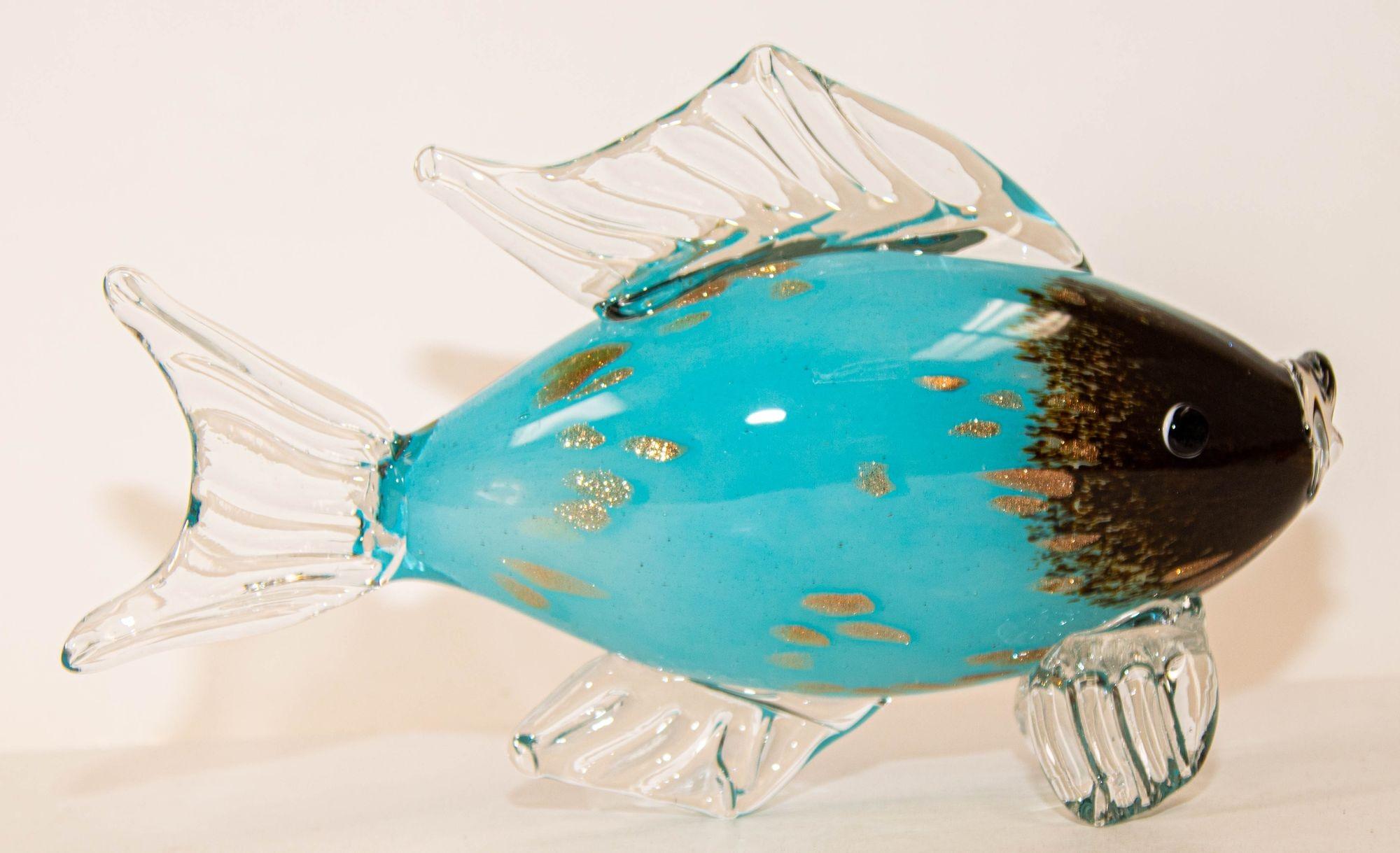 Heavy large Murano art glass fish sculpture with beautiful turquoise and gold murine colors.
An Archimede Seguso style fish figurine in Murano art glass.
A lovely sculpture and a beautiful and unique piece of blown art fish figurine with unique