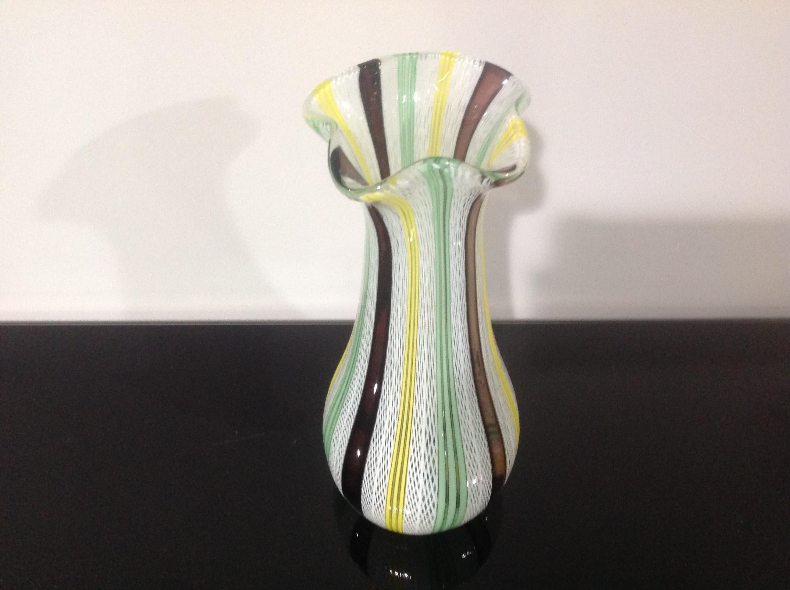 Vibrant and colorful murano latticino vase.