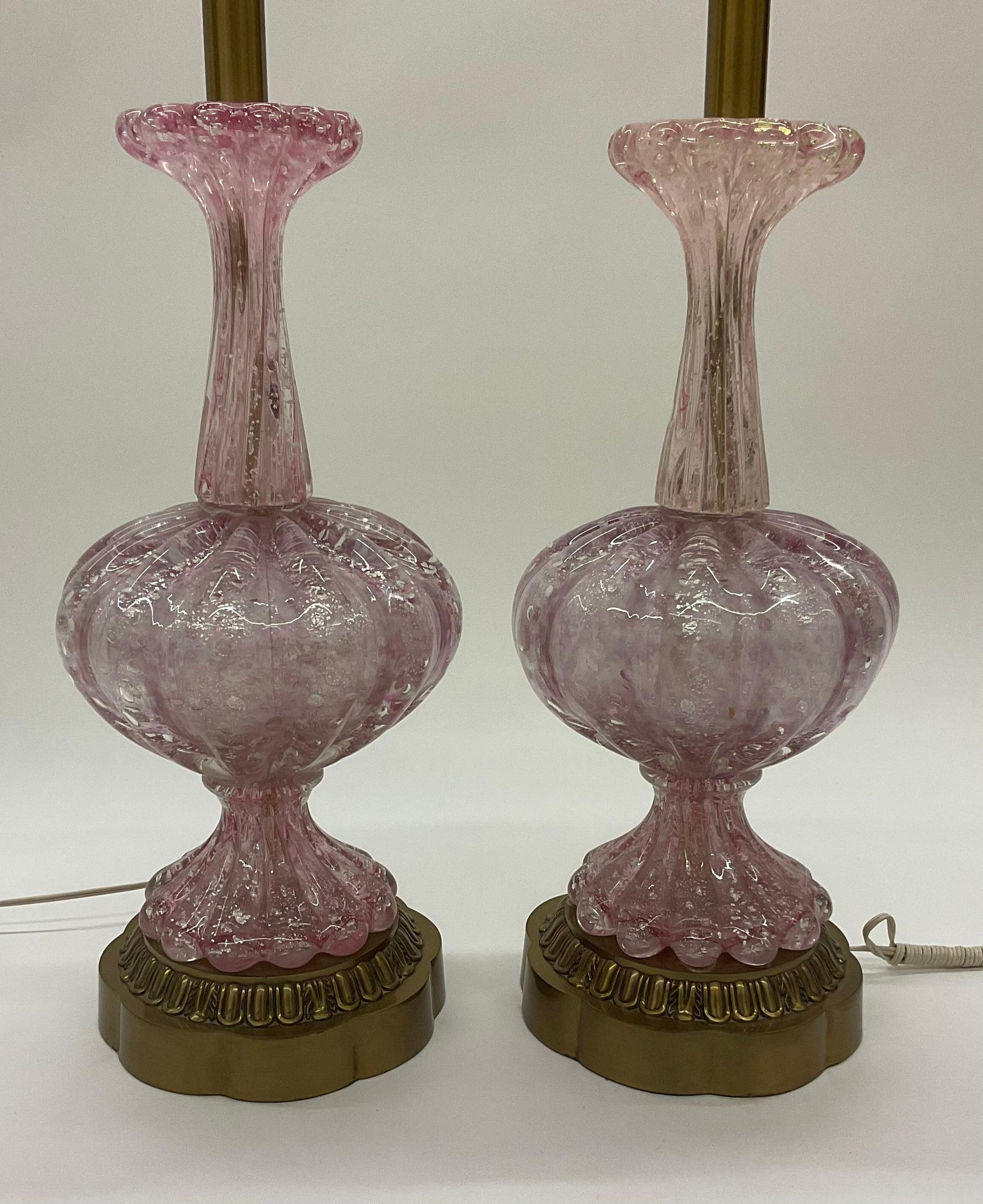 These lamps are attributed to AVeM. Great pair Murano glass lamps in pink irredescent glass with controlled bubbles and silver foil decoration. Glass alone height is 18.5 inches. 

Arte Vetraria Muranese (AVEM) emerged from the liquidation of