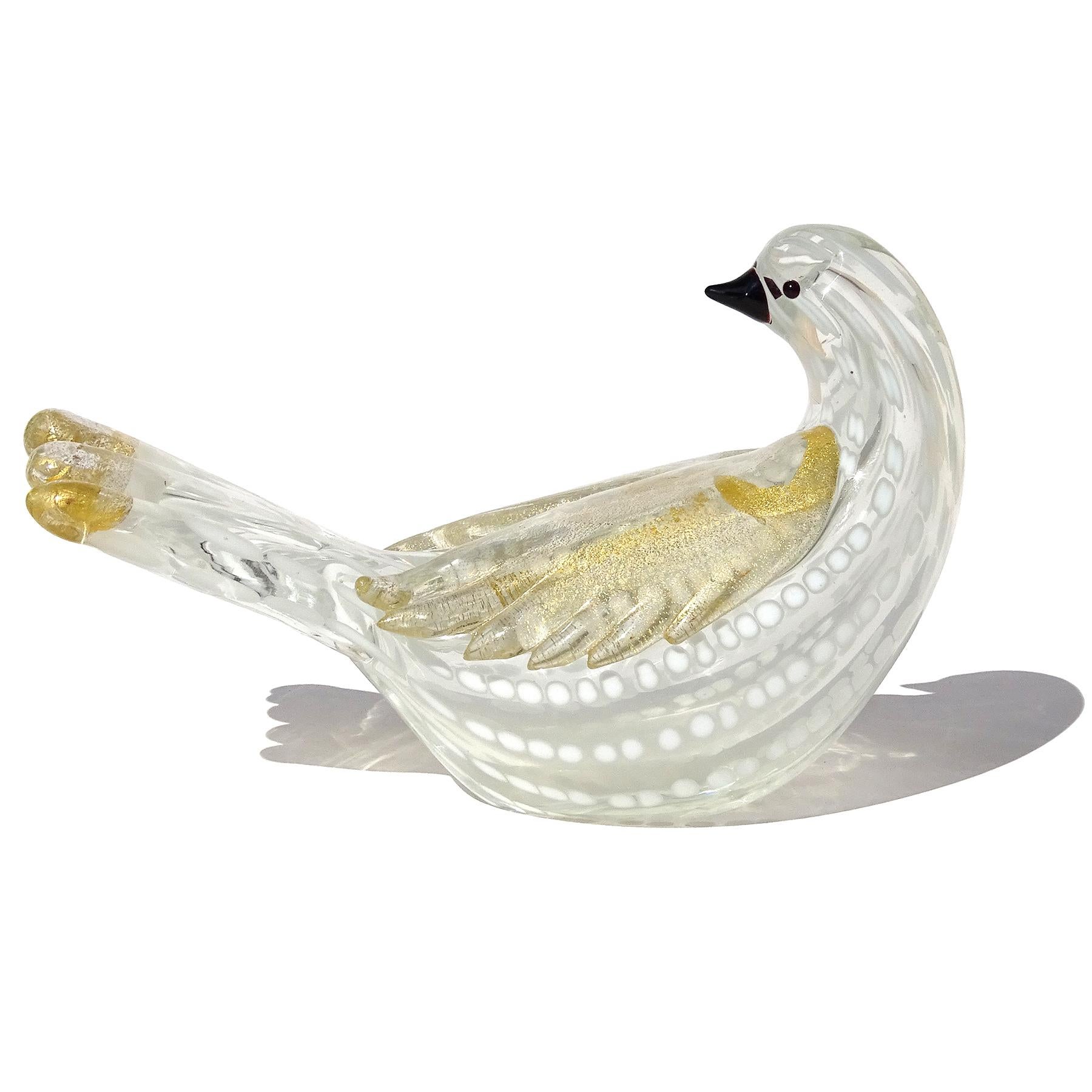 Beautiful vintage Murano hand blown white spots and gold flecks Italian art glass figurine / sculpture. Created in the manner of the Barovier e Toso Company. The bird has a pattern made with lines of white dots on a clear glass body. The wings and