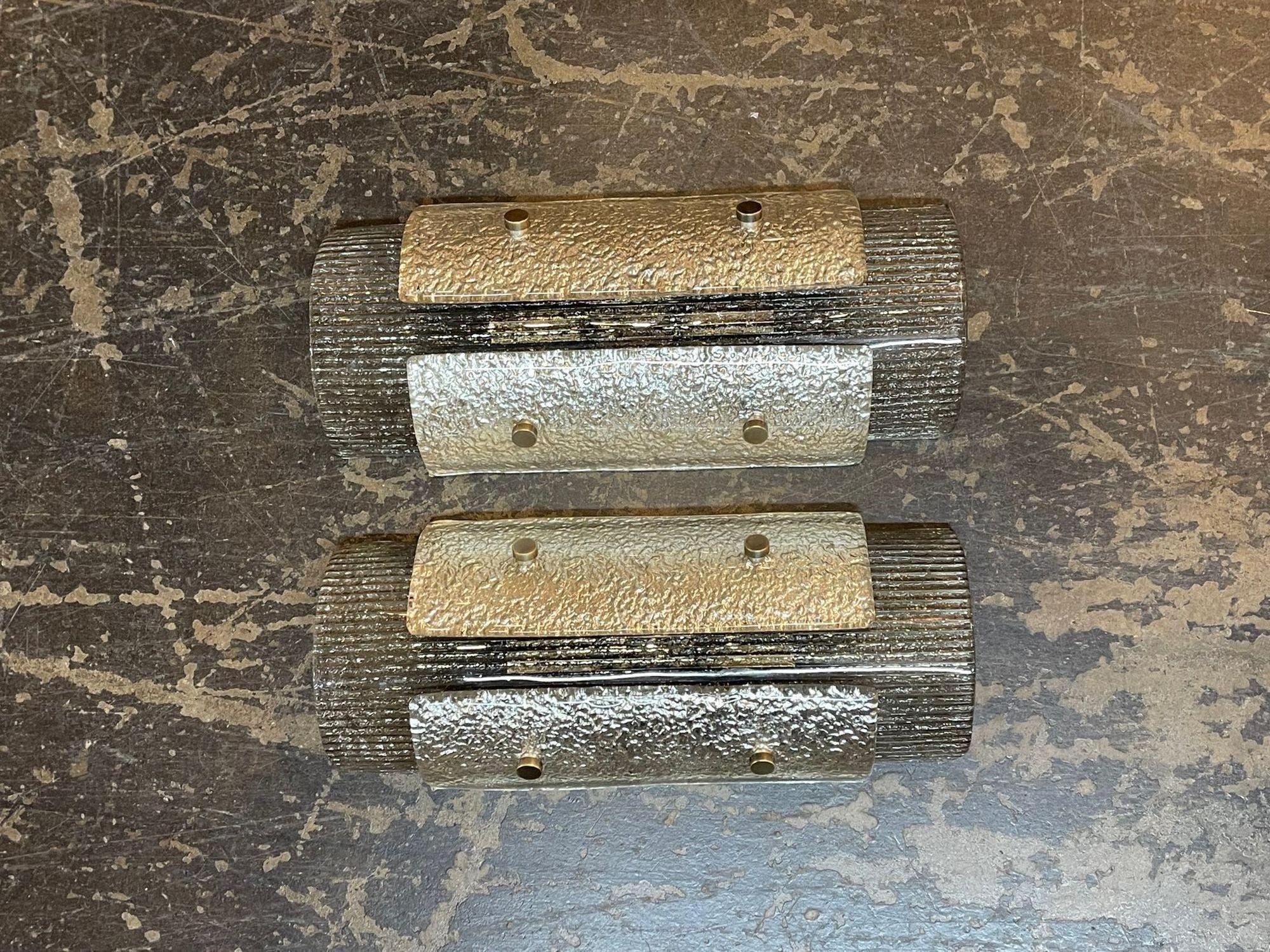 Pair of modern Murano glass two tone layered sconces. Circa 2000. The sconces have been professionally rewired and ready to hang. Perfect for today's transitional designs!.