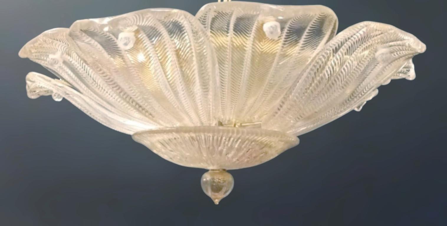 Vintage Italian Murano glass flush mount with clear textured glass leaves / Made in Italy in the style of Barovier e Toso, circa 1960s
Measures: Diameter 23.5 inches, height 8.5 inches
6 Lights / E12 or E14 type / max 40W each
1 available in stock