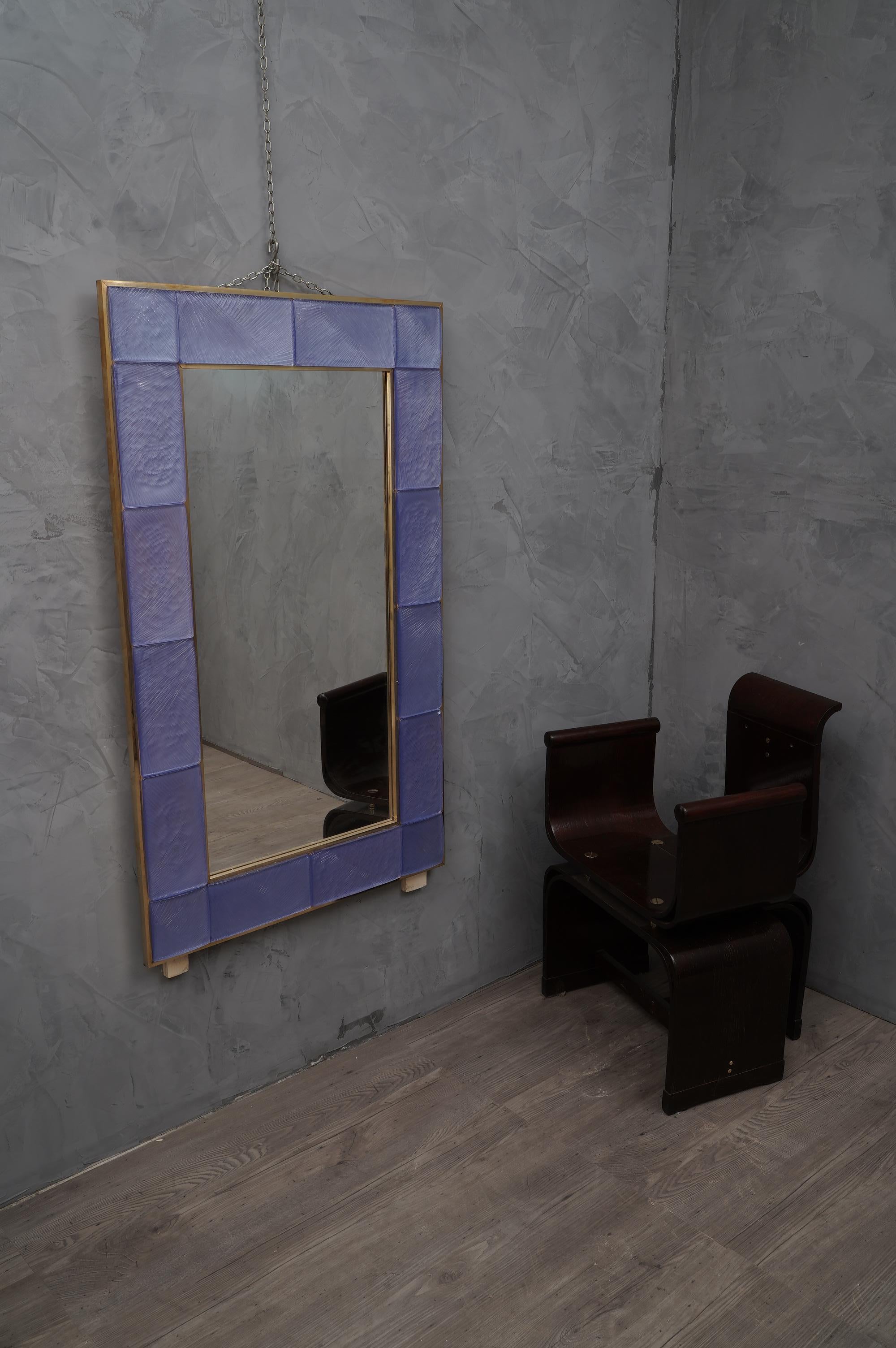 A strong light blue frame, reach the eye of the beholder, leaving him entranced; of Murano light blue art glass wall mirror.

The structure of the wall mirror is in wood, where the blue Murano glass is housed. The frame of the mirror is made up of a