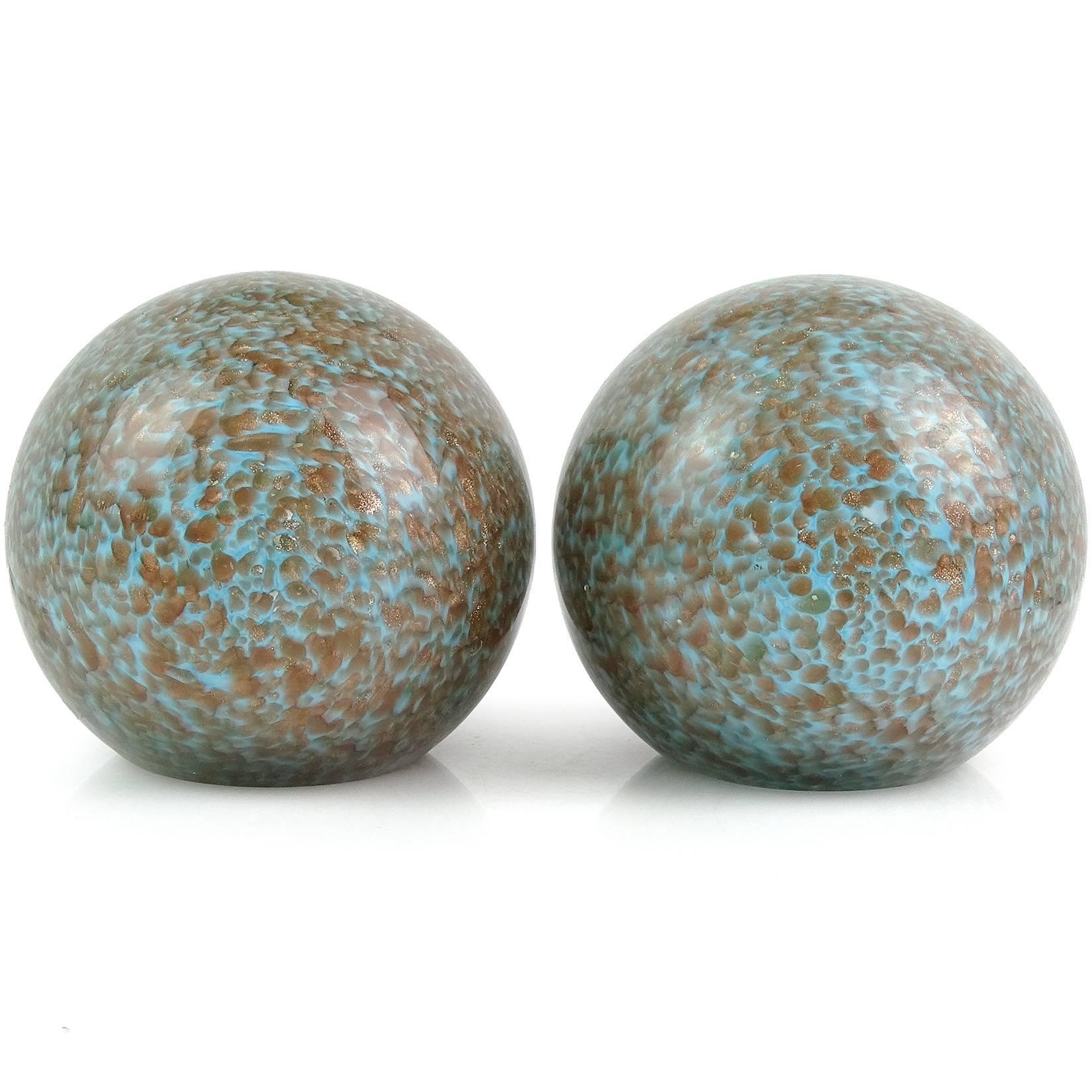 Murano handblown light blue with copper aventurine flecks Italian art glass ball bookends. Attributed to the Fratelli Toso company. They are polished on two sides, looking like geode rocks. The copper spots glitter all around them. They measure a