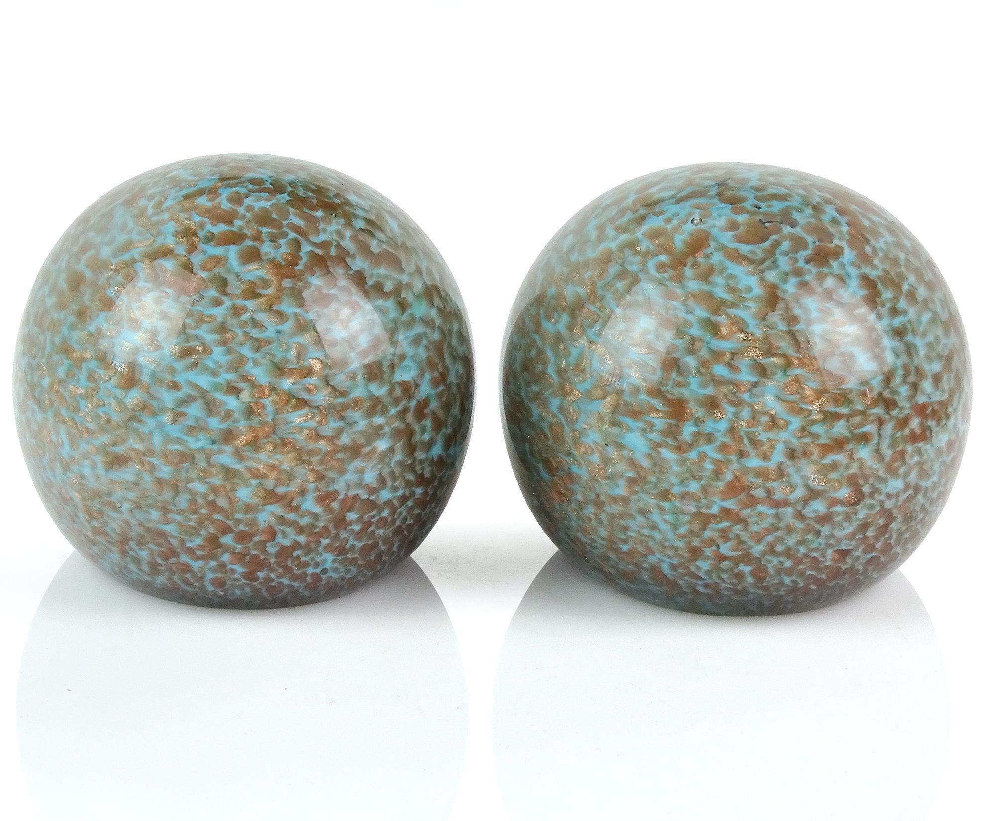 Beautiful vintage Murano hand blown light blue with copper aventurine flecks Italian art glass bookends. Attributed to the Fratelli Toso company. They are polished on two sides, looking like geode rocks. The copper spots glitter all around them.