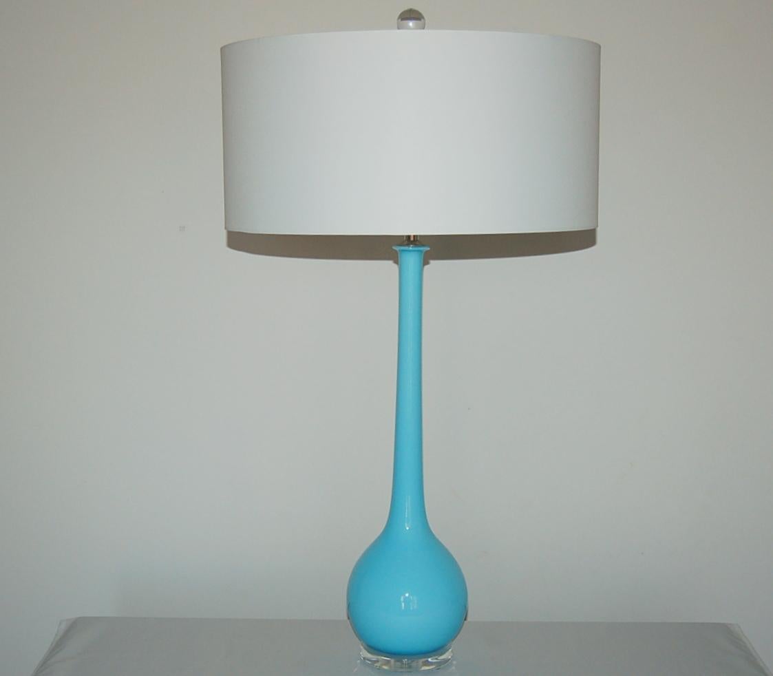 Vintage Murano Long Neck glass table lamps in SKY BLUE by Archimede Seguso, imported in the early 1960’s. Simple, mid-century modern sleek with a wonderful pop of color.

They stand 28.5 inches from tabletop to socket top. As shown, the top of shade