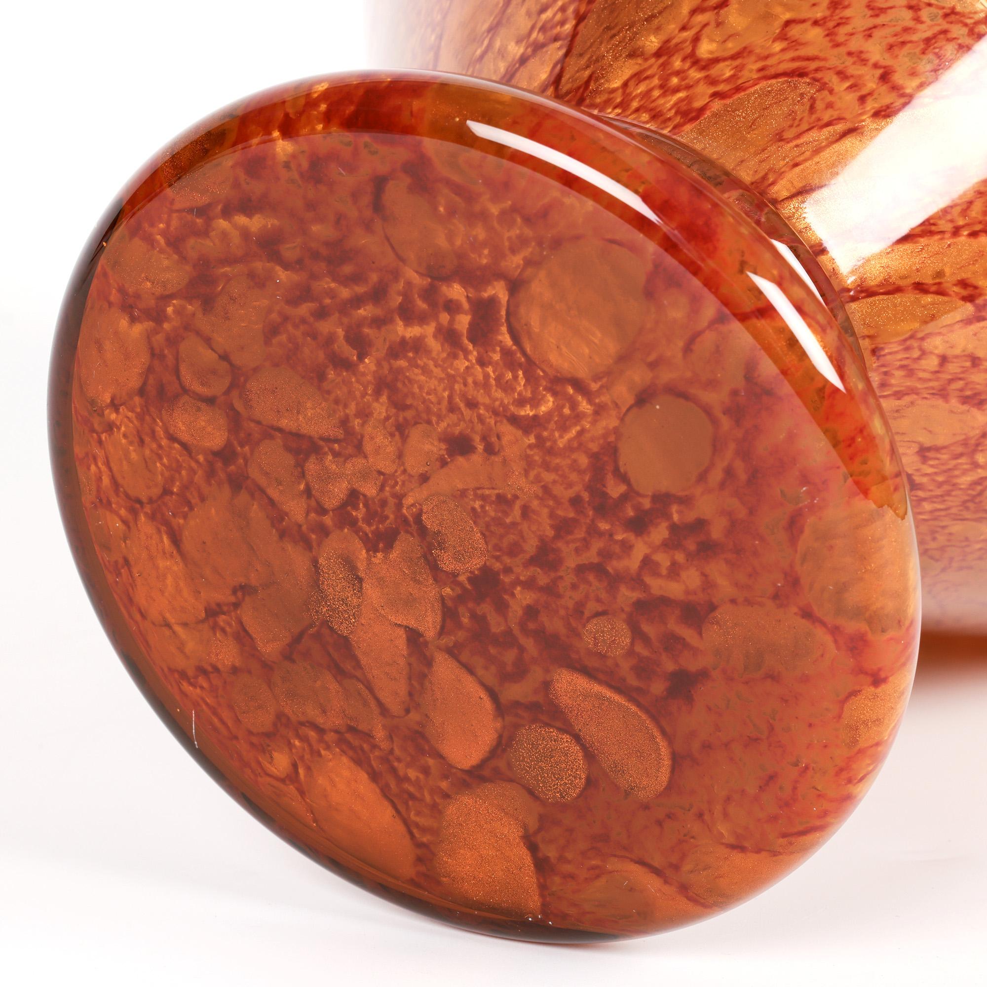An exceptional and large Italian Murano hand-blown art glass vase by Maestri Vetrai dating from the mid to latter 20th century. The vase of shaped bulbous form stands on a splayed round foot with a narrow-collared stem with a widening body, collared