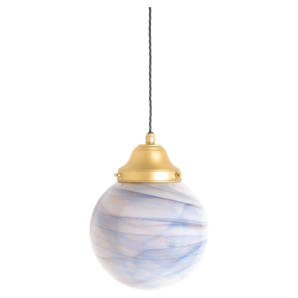 A fabulous run of marbled glass globe pendant lights

English Made circa 1960

Unusual marbled glass globes with tones Blues, Greys and Browns, no globe is the same all have a different finish.

Matte lacquered Satin Brass fittings

A light