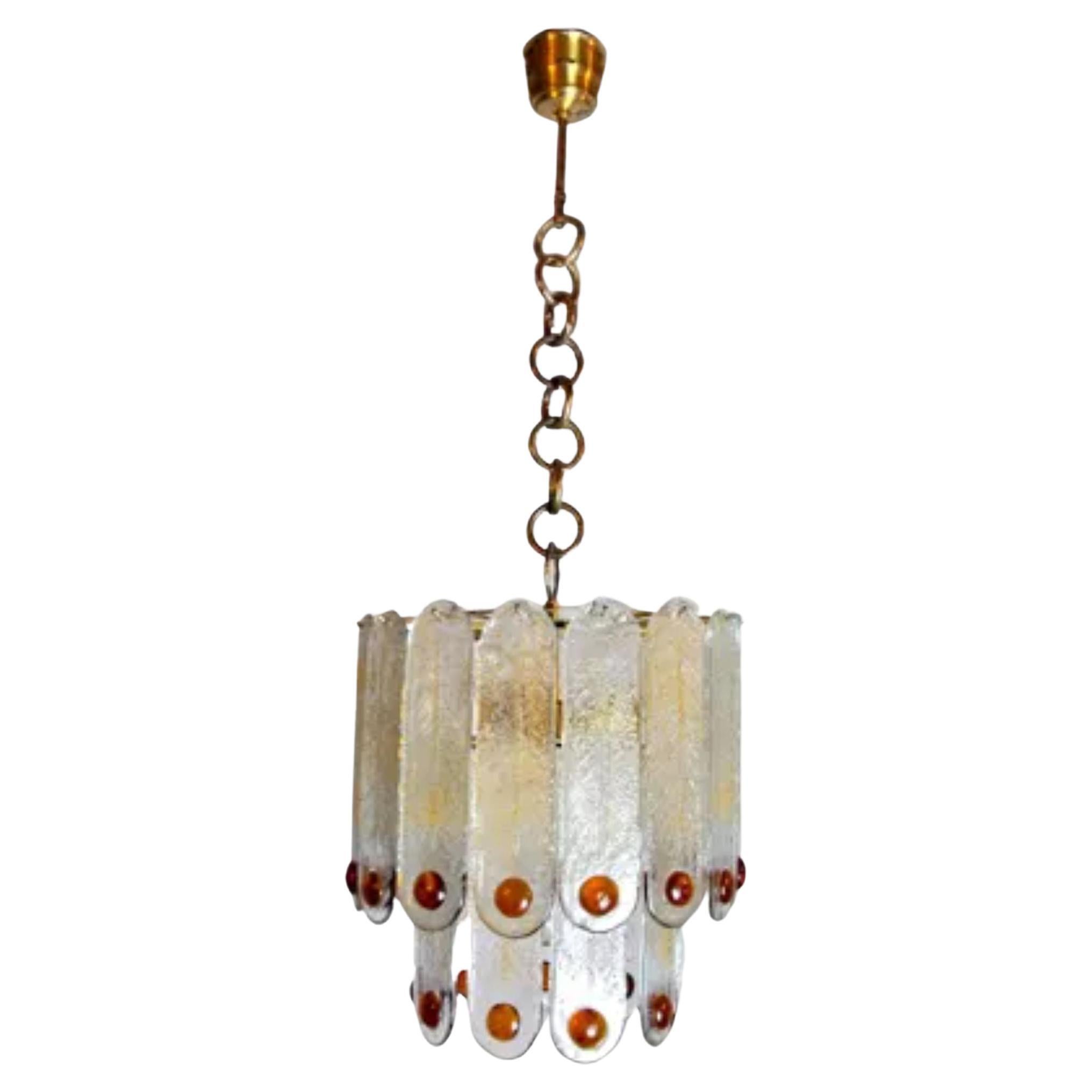 Superb and rare chandelier designed and produced by murano mazzega in italy in the 1960s. orange frosted murano crystals spread over two levels of a gilded metal structure. Rare design object that will illuminate your interior wonderfully.