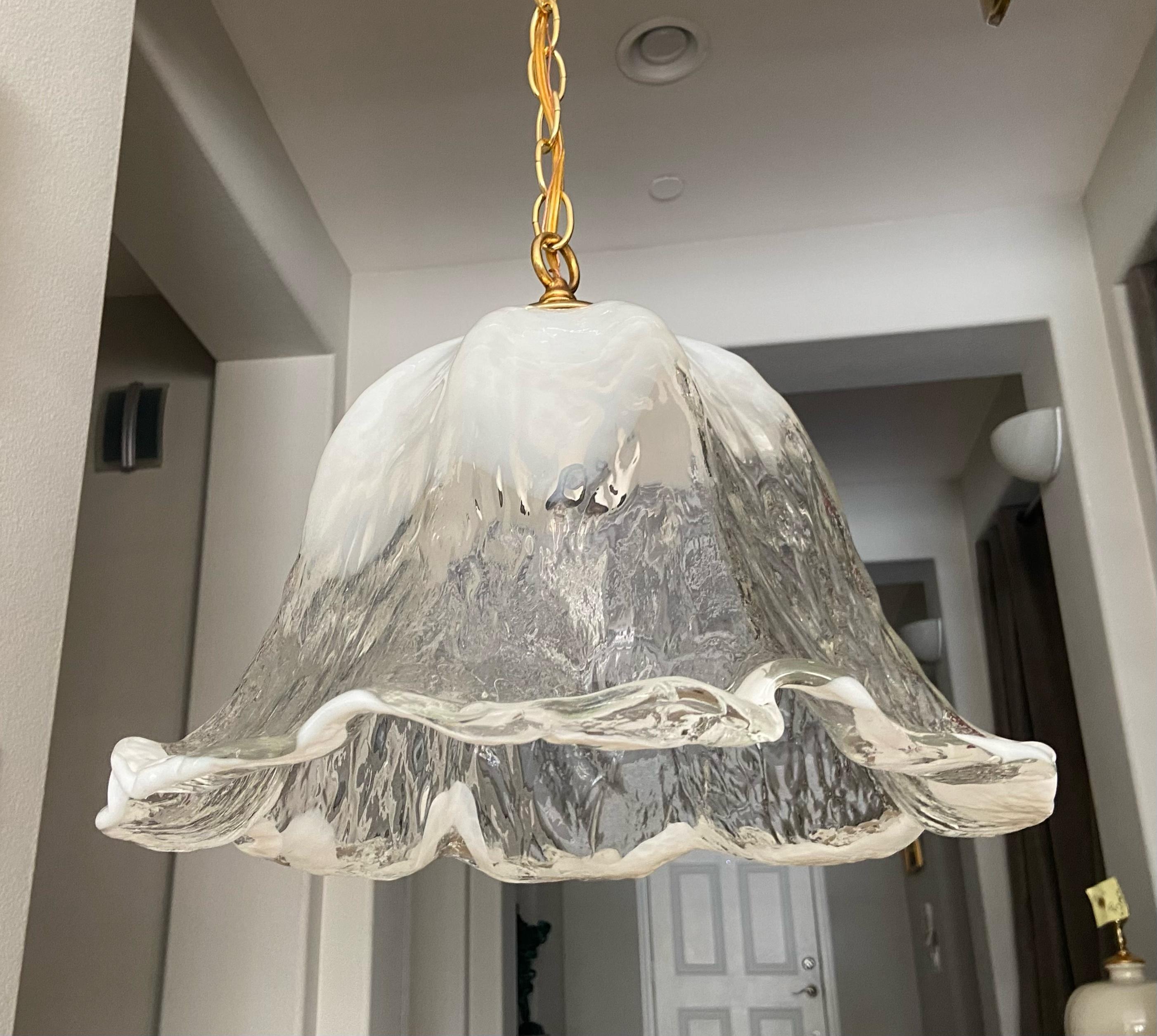 Italian Mazzega tulip shape pendant ceiling light with textured clear and white glass. Murano fixture uses regular A base bulb. Newly wired with new chain and ceiling cap. Perfect for hall, entry or breakfast eating area. 
Fixture size 13