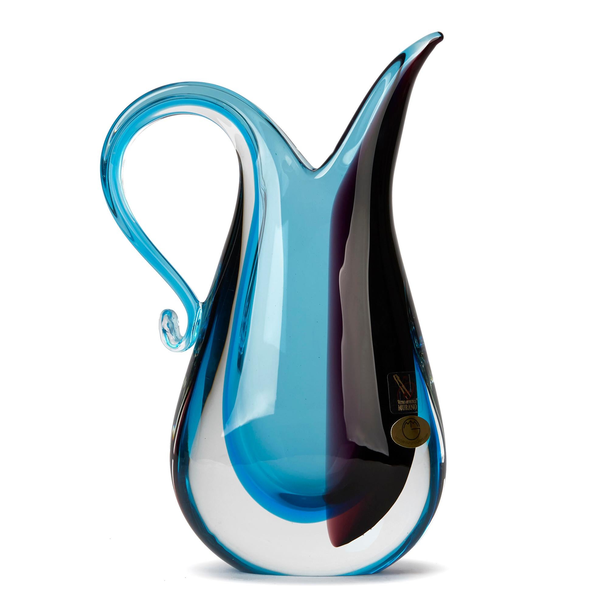 PLEASE NOTE: This piece is currently located in our Amsterdam office, please enquire for delivery times. 

A stunning Italian Murano art glass vase by Michele Onesto. The handmade heavily made vase has a blue sommerso core with a section of