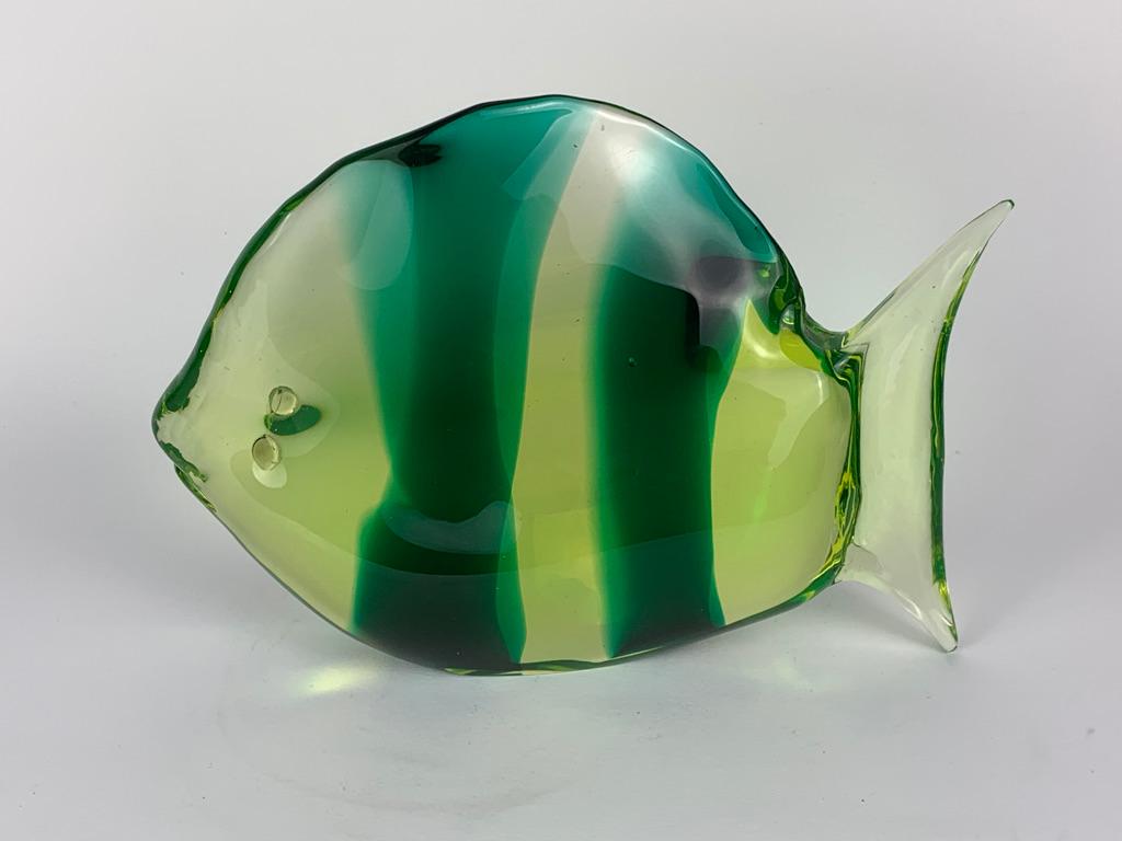 Handmade transparent Murano glass fish with a stylized shape and green face in the body and application with still warm glass of the eyes.
Murano Venice Italy 1950's.