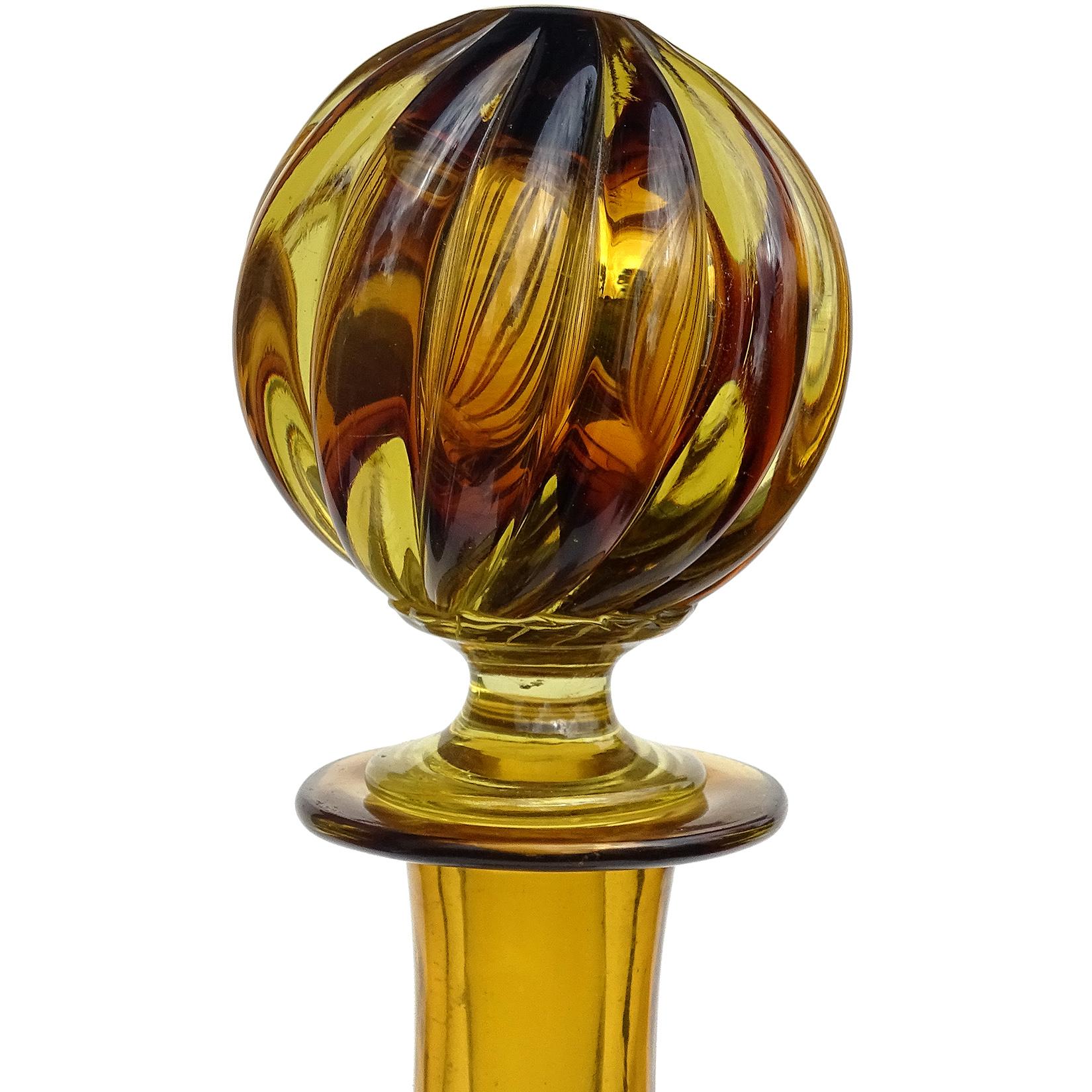 Beautiful vintage Murano hand blown Sommerso dark amber and yellow Italian art glass decanter. Created in the manner of designer Flavio Poli, and the Seguso Vetri d'Arte company. The decanter has a ribbed body design. Made of thick glass. Would make