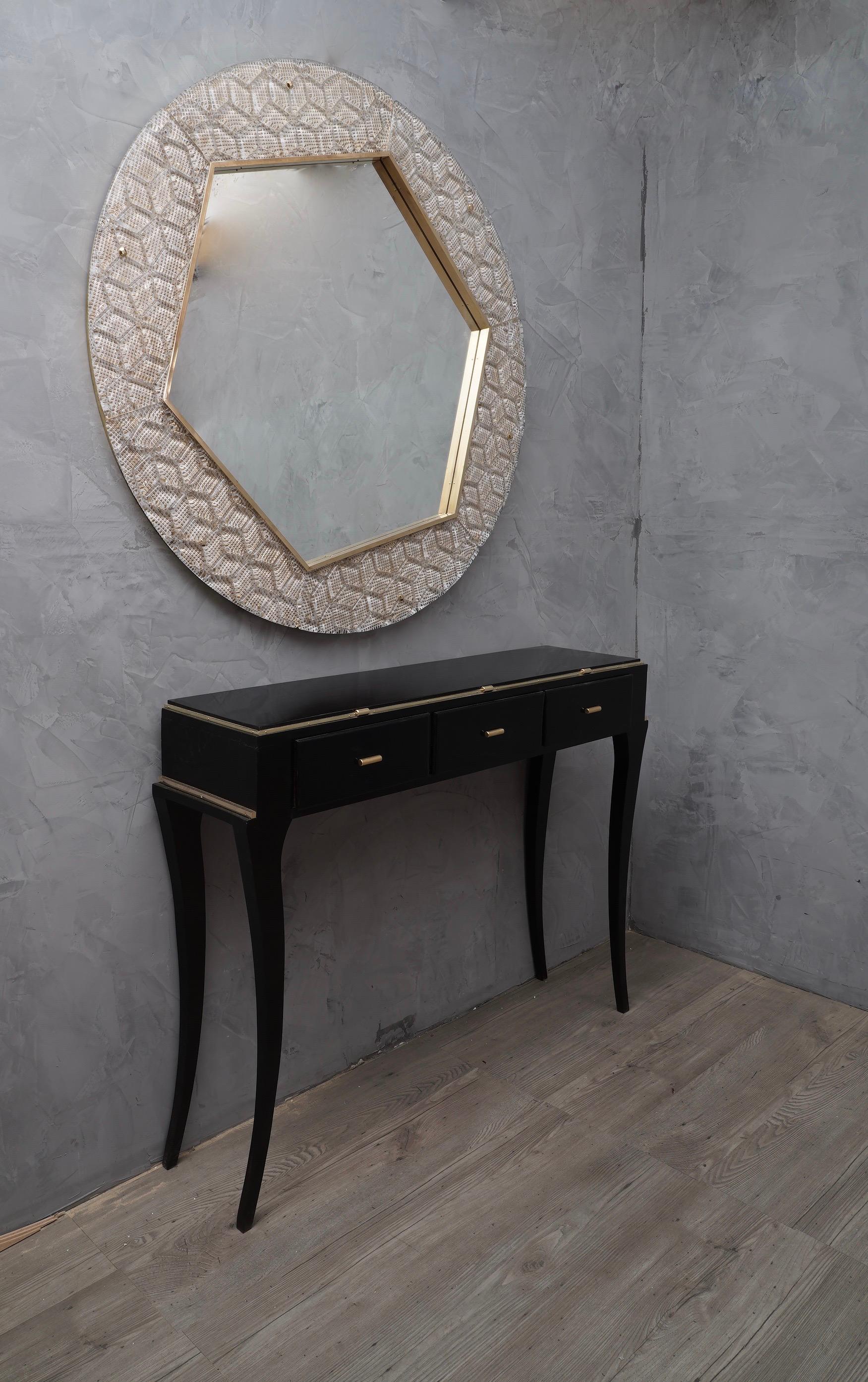 A strong white and gold frame reach the eye of the beholder leaving him entranced; a Murano white and gold art glass wall mirror.

The round rear structure of the mirror is made of wood, six large shaped glass plates have been applied above. The