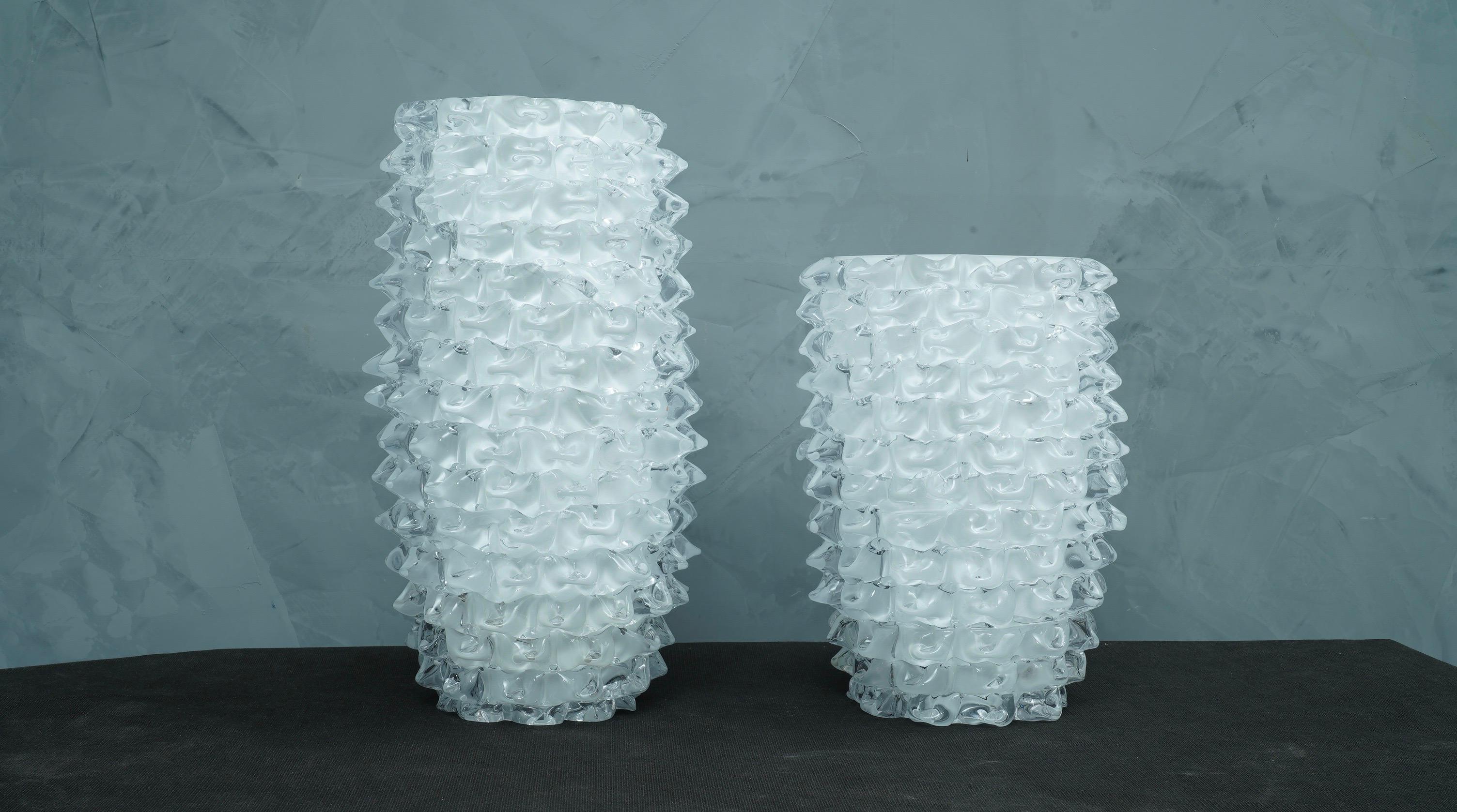 Fantastic vase from the Murano glassworks, both for its special processing and for its double color, in fact the vase is transparent but has an internal white coating, called 