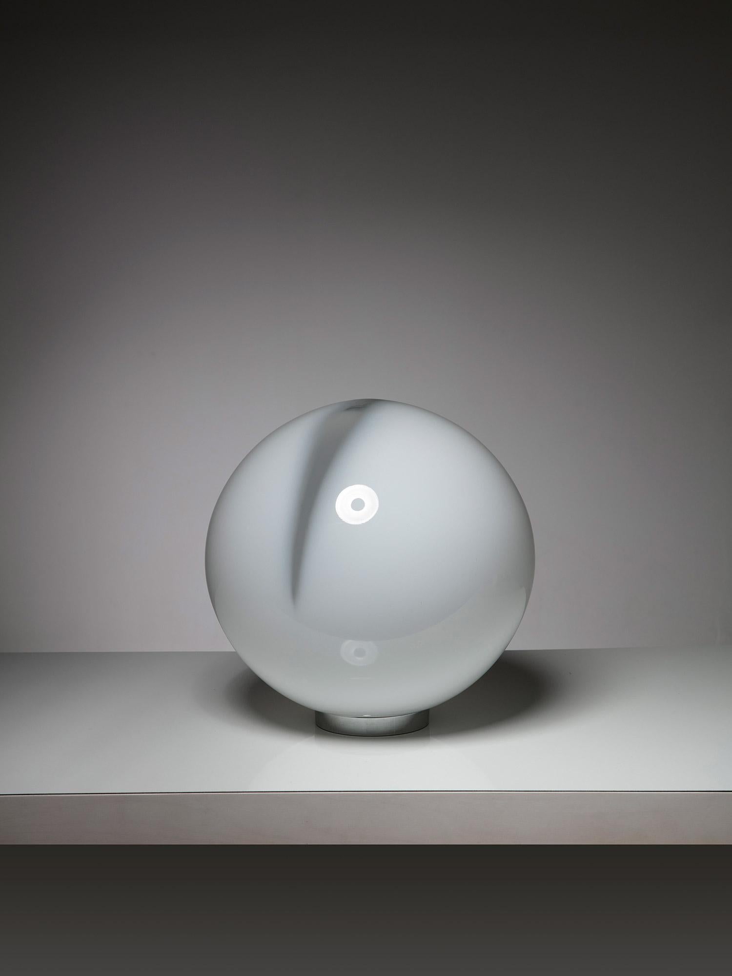 Rare table lamp by Alfredo Barbini for Barbini.
Large Murano glass opaline sphere with a central crystal stripe.
An emotional table-sized full moon. 