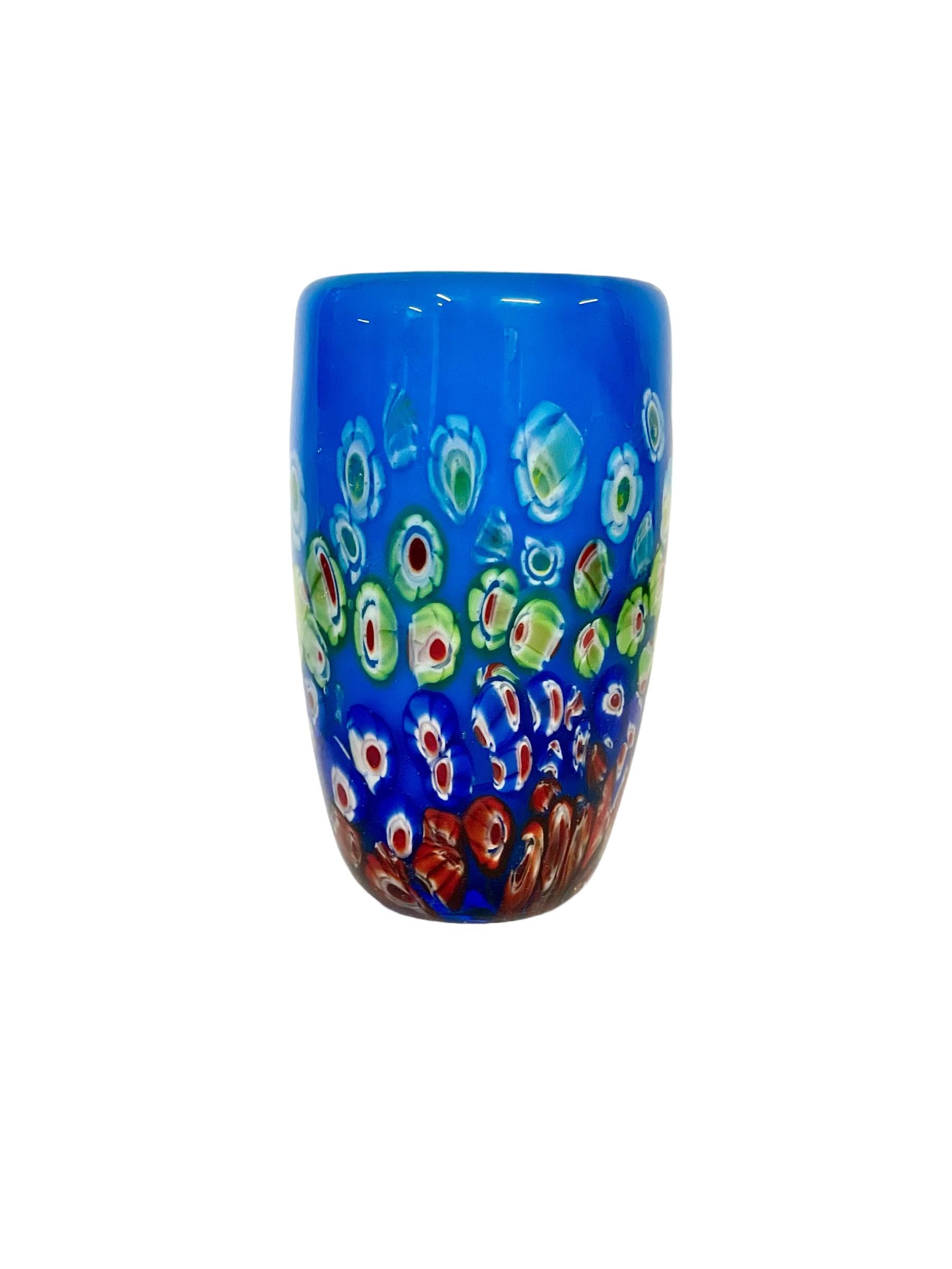 A beautiful Murano blown glass 'Millefiori' vase in deepest sky blue, with a decoration reminiscent of sliced sweets. This gorgeous effect has been created by the use of 'murrine', which is an Italian term for coloured patterns or images made in