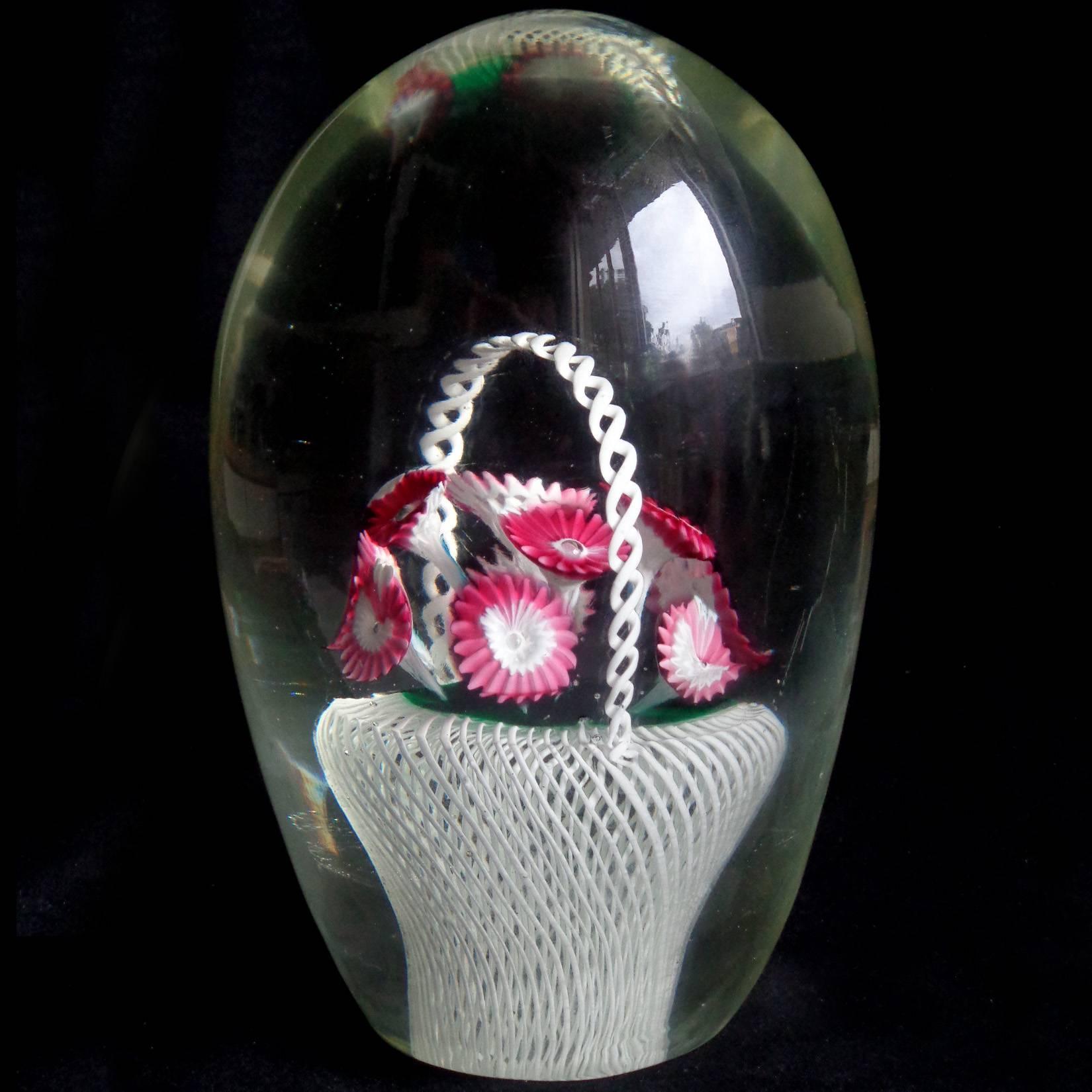 Beautiful, large vintage Murano handblown white filigrana basket with flower murrines Italian art glass paperweight on lighted base. Documented to the Fratelli Toso company. It has dark pink and white flowers, inside a masterfully done white ribbon
