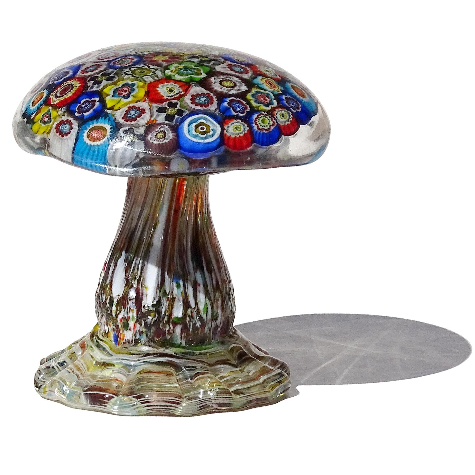 Beautiful and very unusual, vintage Murano hand blown multicolor millefiori flowers Italian art glass mushroom / toadstool sculptural paperweight. The mushroom is created in the manner of the Avem company. The top is filled with a multitude of