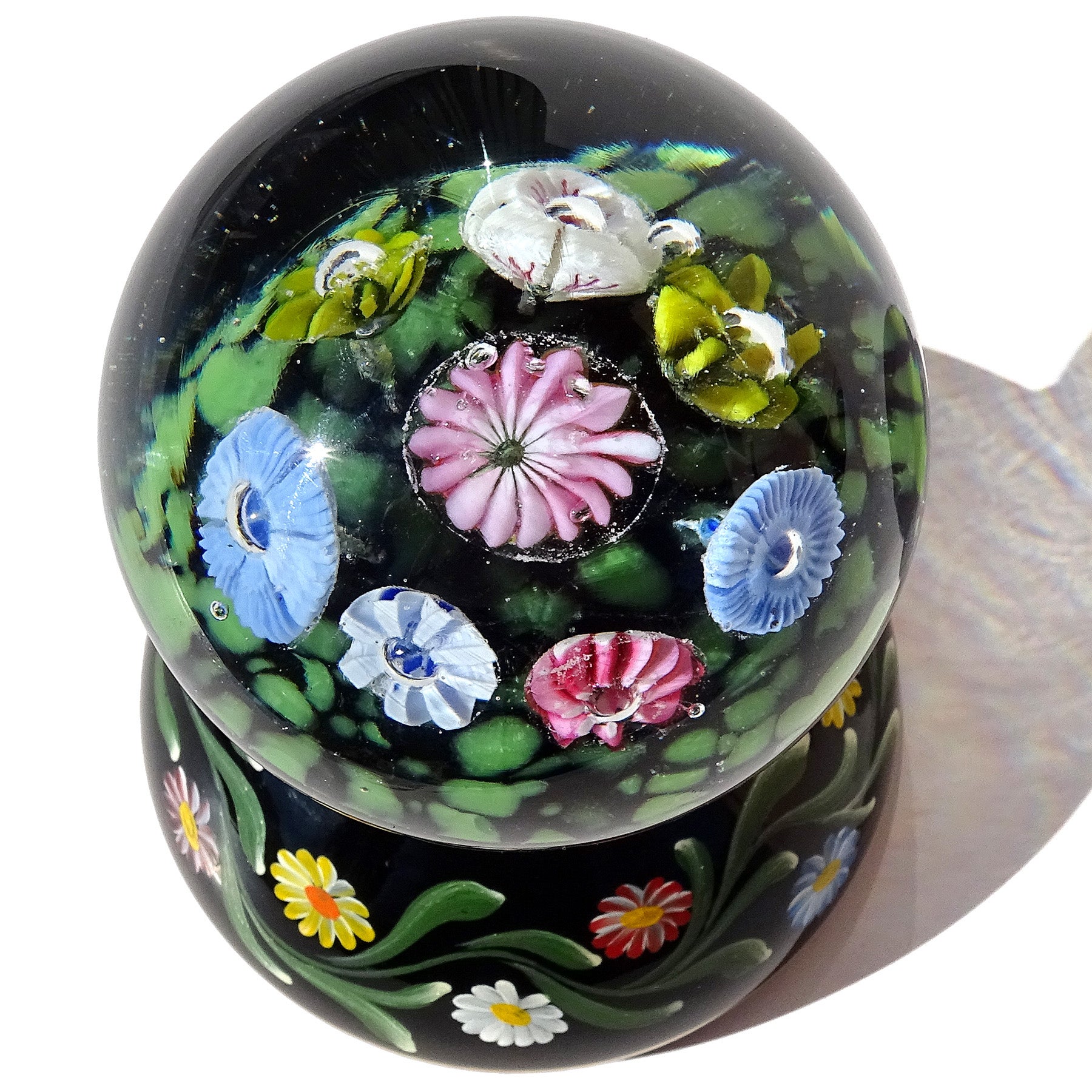 Beautiful vintage Murano hand blown colorful spring wild flowers Italian art glass pedestal paperweight. Created in the manner of the Fratelli Toso and Galliano Ferro companies. The inside of the clear glass globe has 6 different flowers, in 4