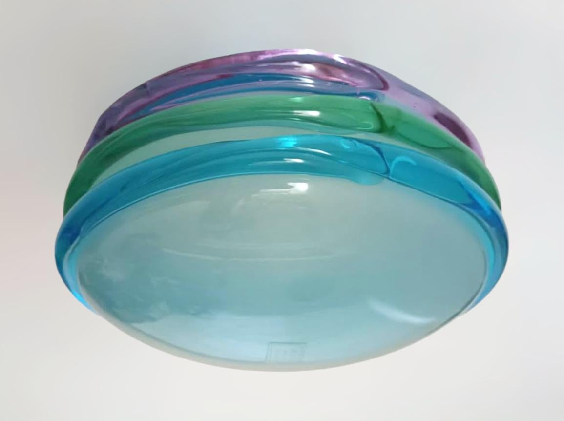 Vintage Italian flush mount or wall light with a frosted Murano glass shade decorated with blue green and purple ribbing / Made in Italy by Venini, circa 1960s
Measures: diameter 8.5 inches, height 4 inches
1 light / E12 or E14 type / max 40W
2