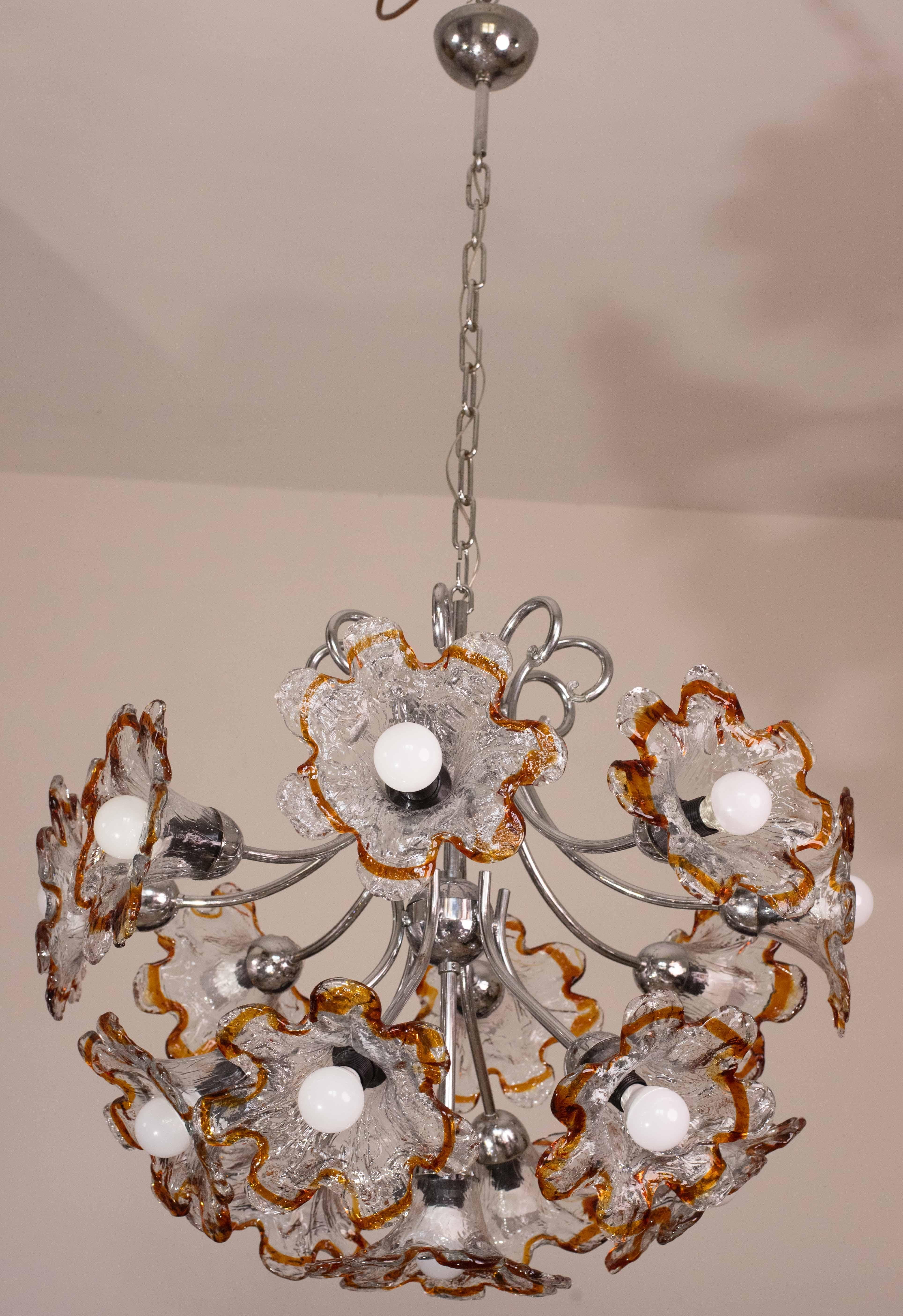 Italian multicolored Murano glass chandelier by Mazzega from the 1970s, fitted with standard European E14 sockets.

Composed of 15 flowers with one light each.

Measurements: height 125 centimeters with chain, 70 centimeters without chain, diameter