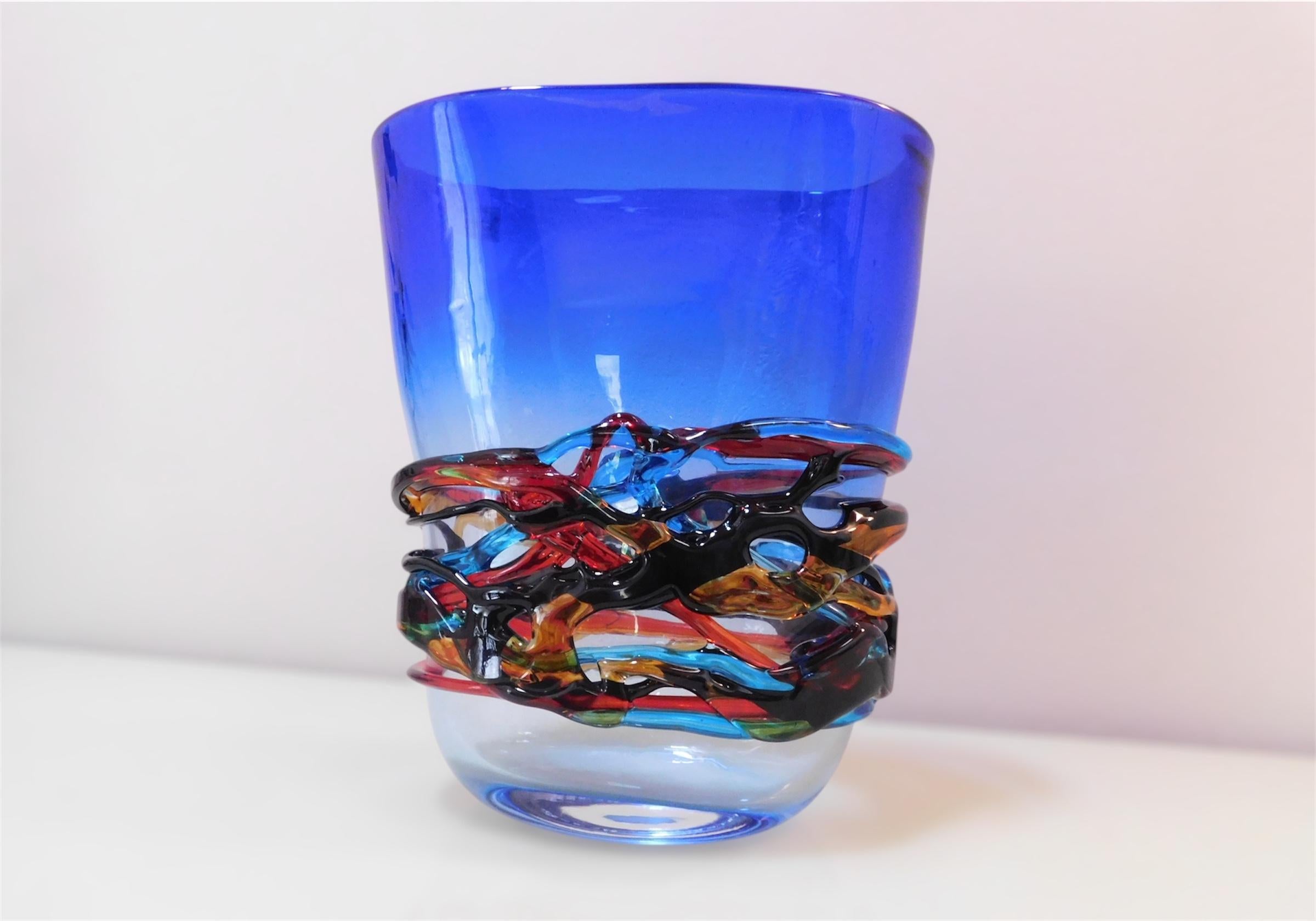 Italian Murano art glass vase with an elegant gradient of dark blue color to transparent and multicolored decorations / Made in Italy by Giuliano Busato, circa 1990s
Original maker's mark underside
Measures: Height 12.5 inches, width 11 inches,