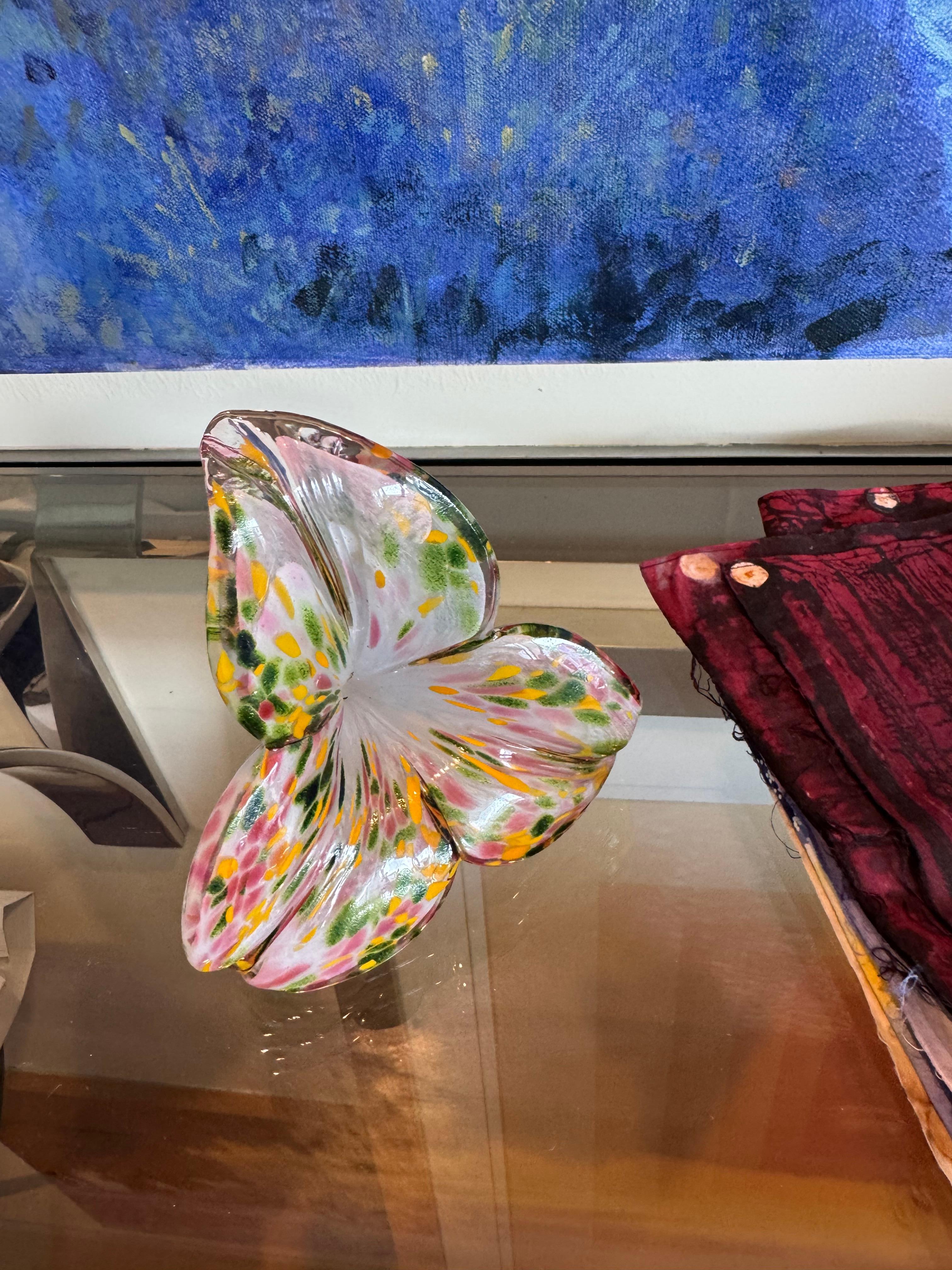 This flower is handblown.
It was crafted in Murano, Italy. 
It is multicolored with 3 petals.
Makes for a great gift.