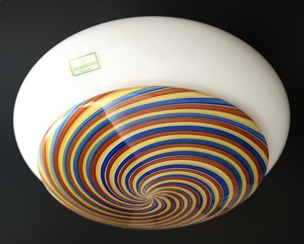 Vintage Italian flush mount with a hazelnut shaped Murano glass shade and multicolored spirals / Made in Italy, circa 1960s
Measures: diameter 12 inches, height 6 inches
1 light / E26 or E27 type / max 60W
1 available in stock in Italy
Order
