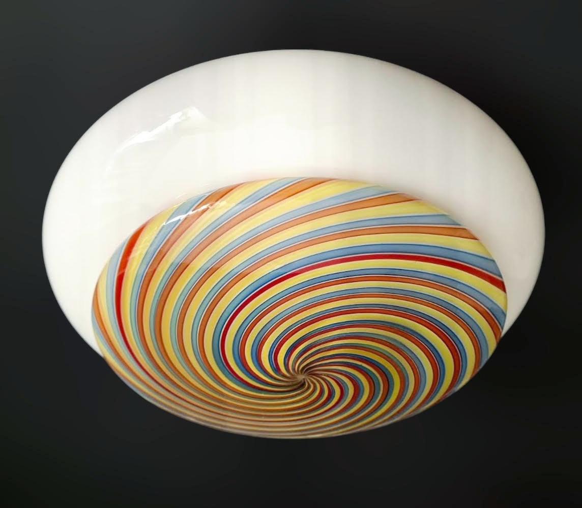 Vintage Italian flush mount with a hazelnut shaped Murano glass shade and multicolored spirals / Made in Italy, circa 1960s
Measures: diameter 12 inches, height 6 inches
1 light / E26 or E27 type / max 60W
1 available in stock in Italy
Order