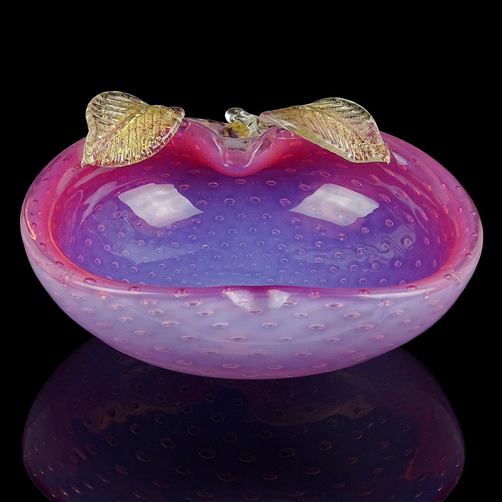 Beautiful vintage Murano hand blown opalescent white and pink, with gold flecks Italian art glass apple shaped decorative bowl or vide-poche. The piece is made in the Bullicante technique, with even bubbles throughout. It has leafs and stem attached