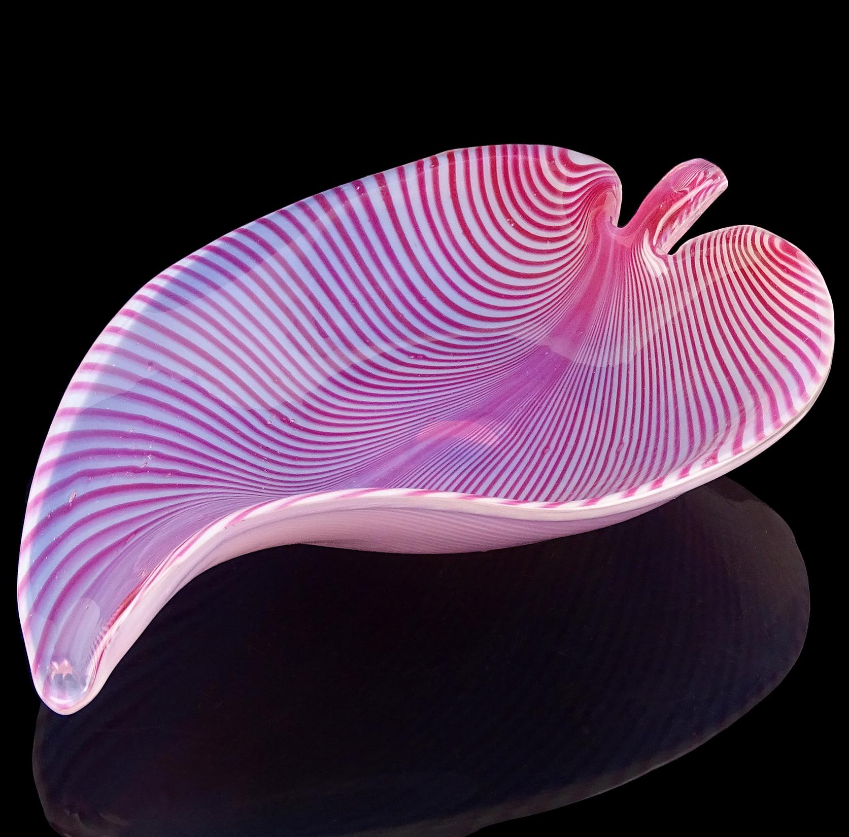 Beautiful, vintage Murano hand blown opalescent white and pink Italian art glass leaf shaped centerpiece bowl. Attributed to the Fratelli Toso company. The bowl has a pulled feather design with pink stripes, creating a gorgeous pattern. Would make a