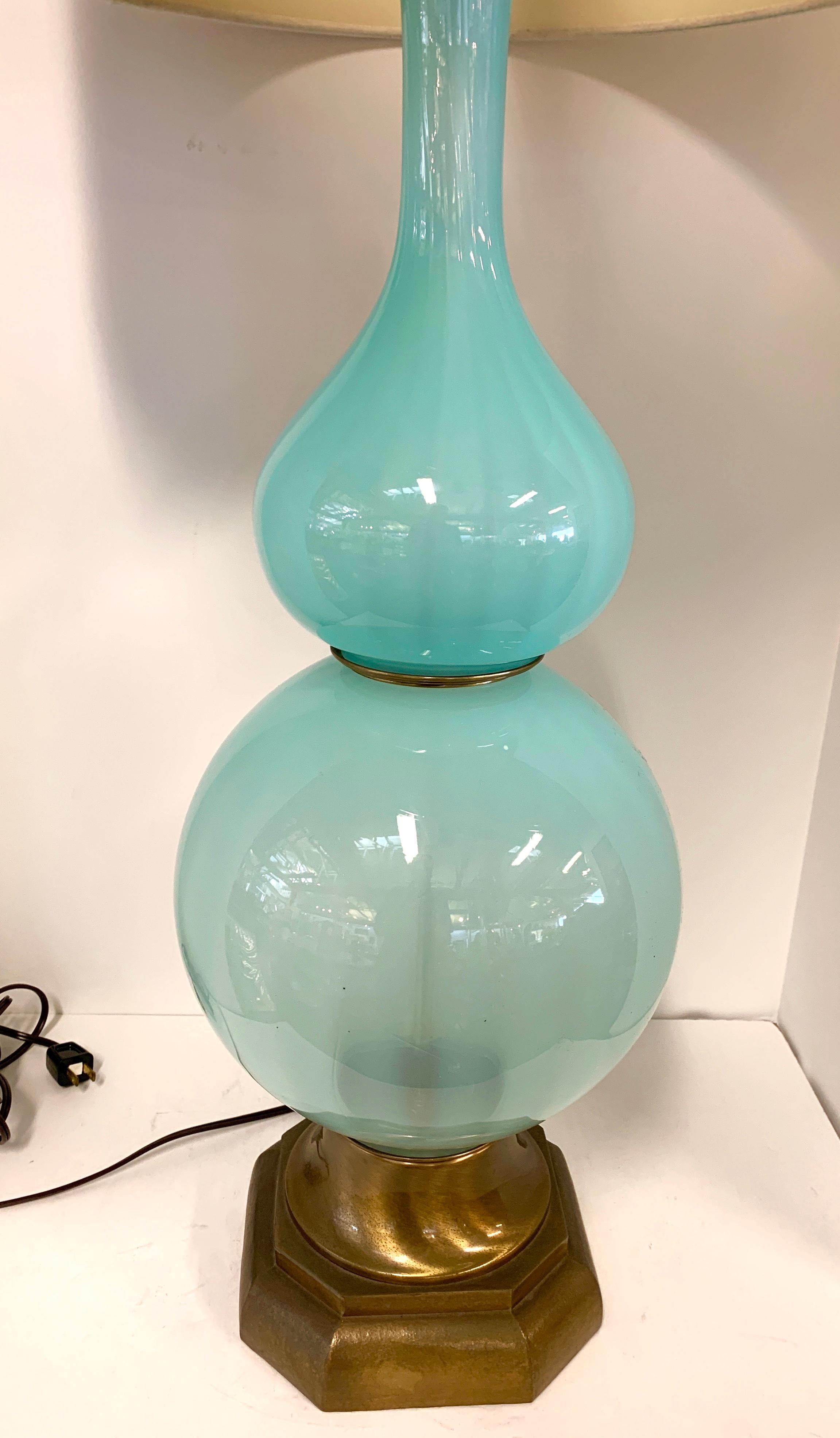 A vintage pretty and large Opaline Glass lamp with brass colored base. Lovely color. Rewired and with new fittings. Shade is included but has a few spots. The brass base has nice aged patina with some marks, pictured. Lamp is in good overall