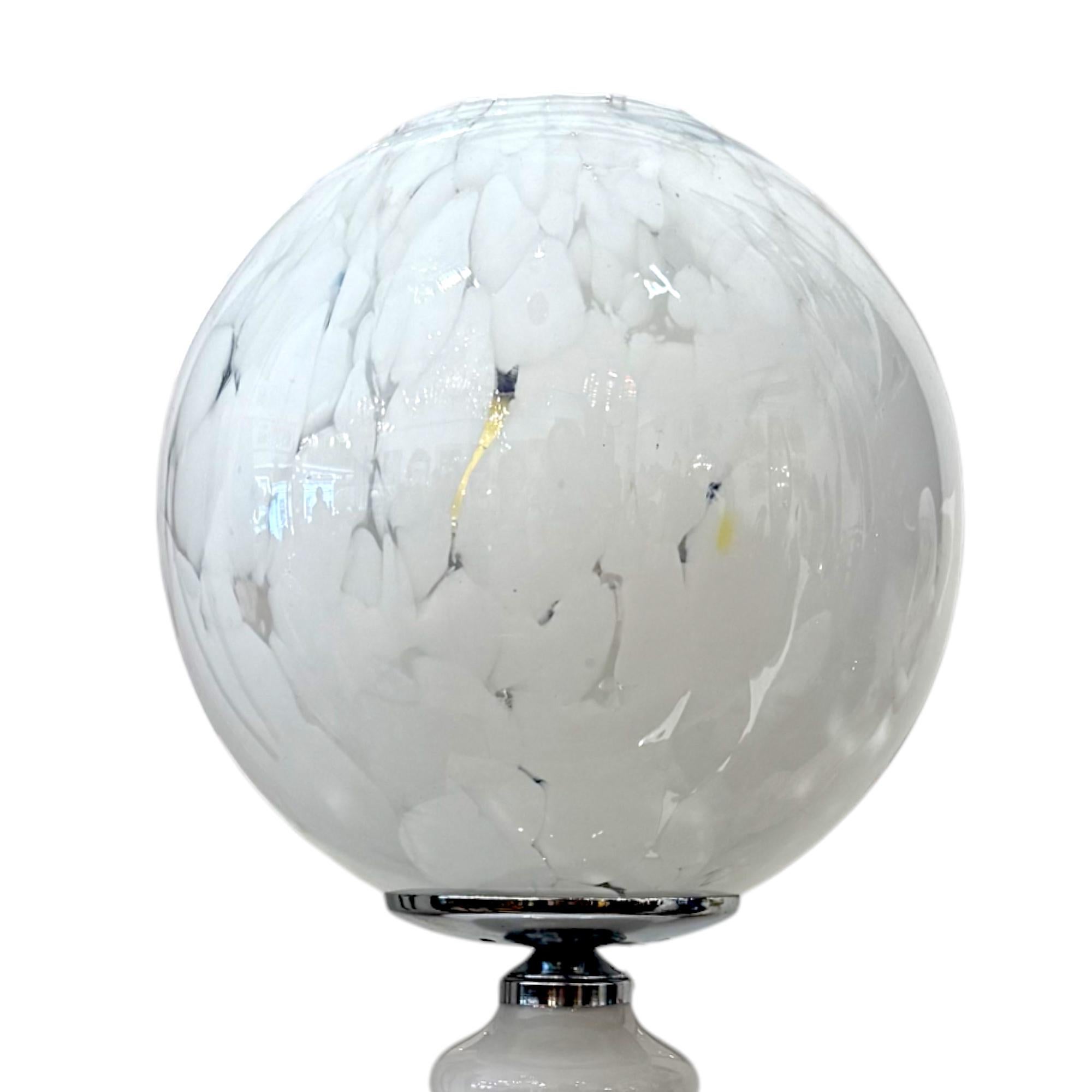 A sculptural Murano glass table lamp attributed to renowned Italian designer Carlo Nason, circa 1970s. This elegant piece exemplifies the refined craftsmanship of Murano glassblowing with its rich opaline surface and harmonious, organic form.  

The