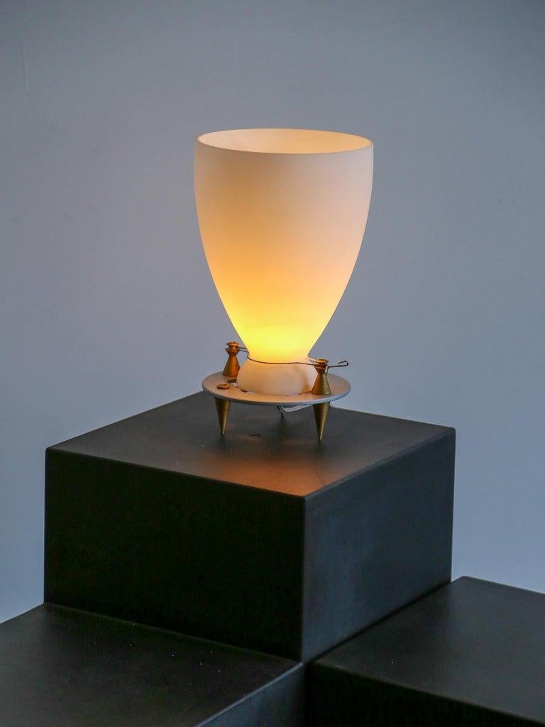 Table lamp, model Franceschina. Designed by Umberto Riva in 1989. Produced by Fontana Arte with the highest quality materials such as bronze and soft satin opaline glass.  
Umberto Riva is an Italian architect and designer known for his work in