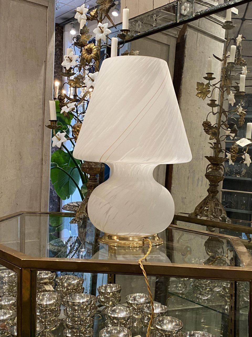 A rare find, this large Italian Murano ‘mushroom’ table lamp is an absolute classic form from the 1970s-80s. Mouth blown glass, and with a charming white swirling pattern within, and beautifully raised on a gilded base. In perfect condition with new
