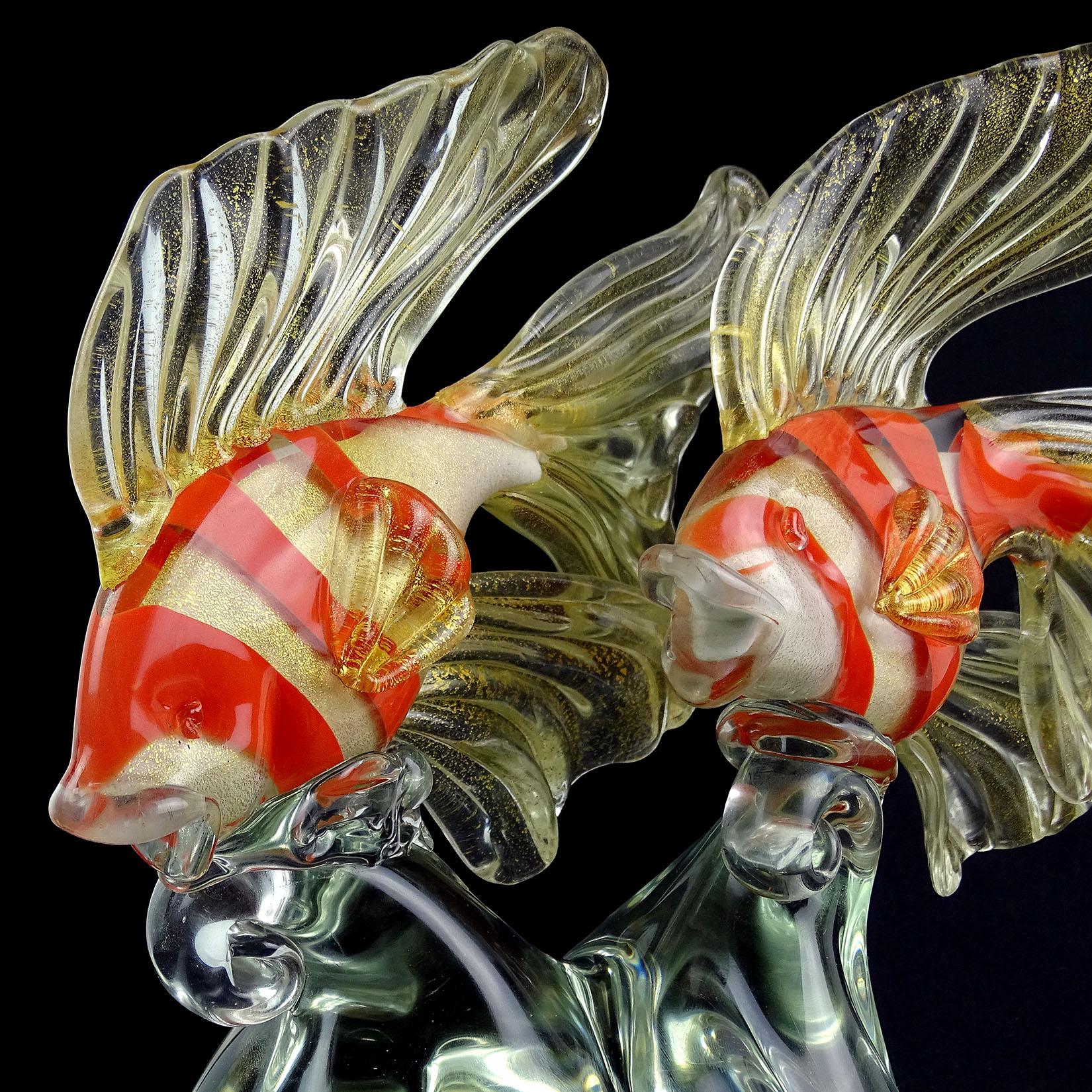 Beautiful large Murano hand blown white fancy goldfish with orange stripes and gold flecks Italian art glass centerpiece sculpture. Documented to designer Alfredo Barbini, and published in his catalog. The sculpture has 2 fish figures attached to a