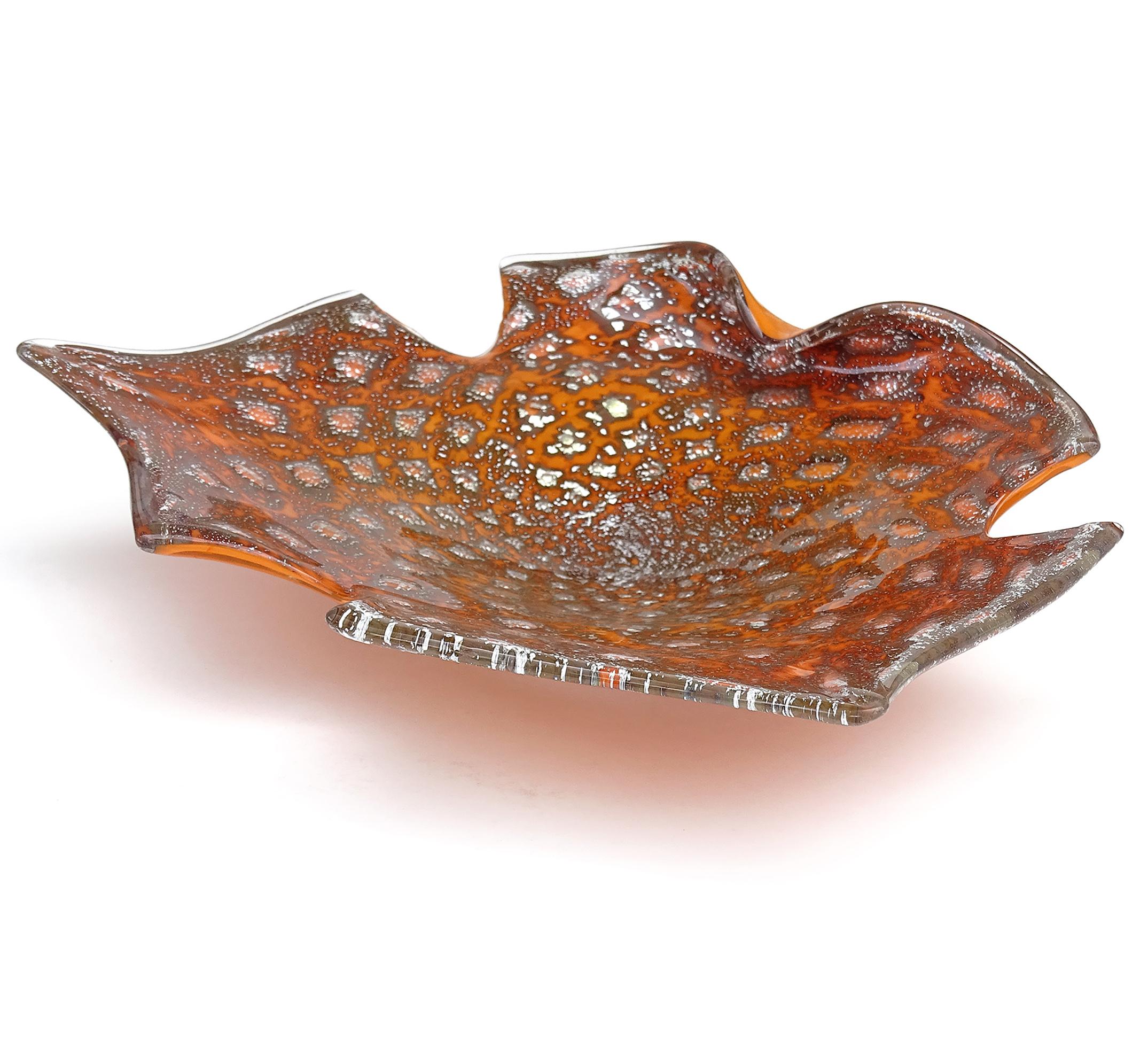 Beautiful and unusual vintage Murano hand blown orange, controlled bubbles and silver flecks Italian art glass abstract bowl. The piece has a scissor cut rim in the shape of a butterfly, with one fold on the edge. It is profusely covered in silver