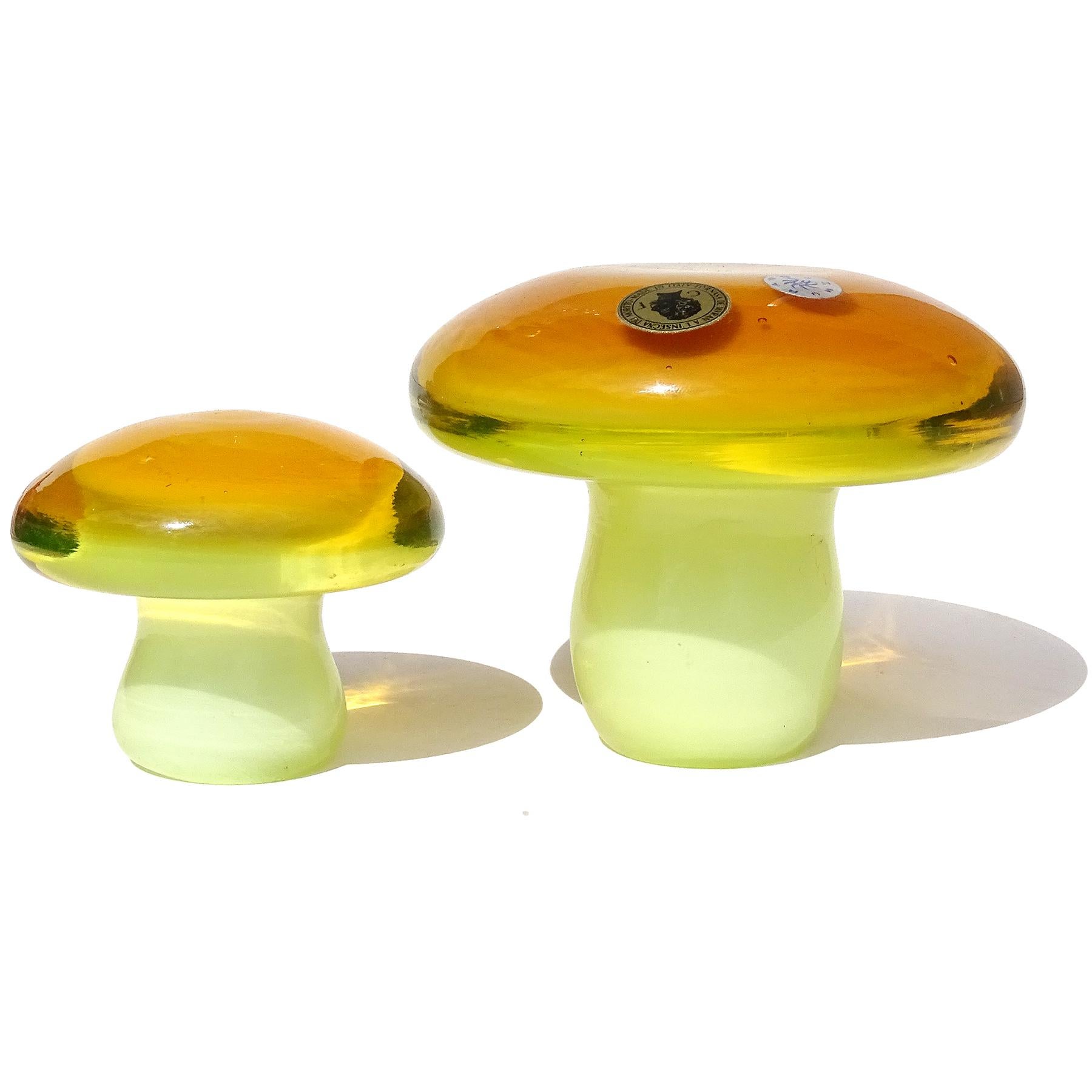 Beautiful vintage Murano hand blown Vaseline yellow, orange and white Italian art glass mushroom / toadstool set. Created for the Fornasa De Murano A L'Insegna Del Moreto Company, and attributed to designer Galliano Ferro. Each has 2 original, close