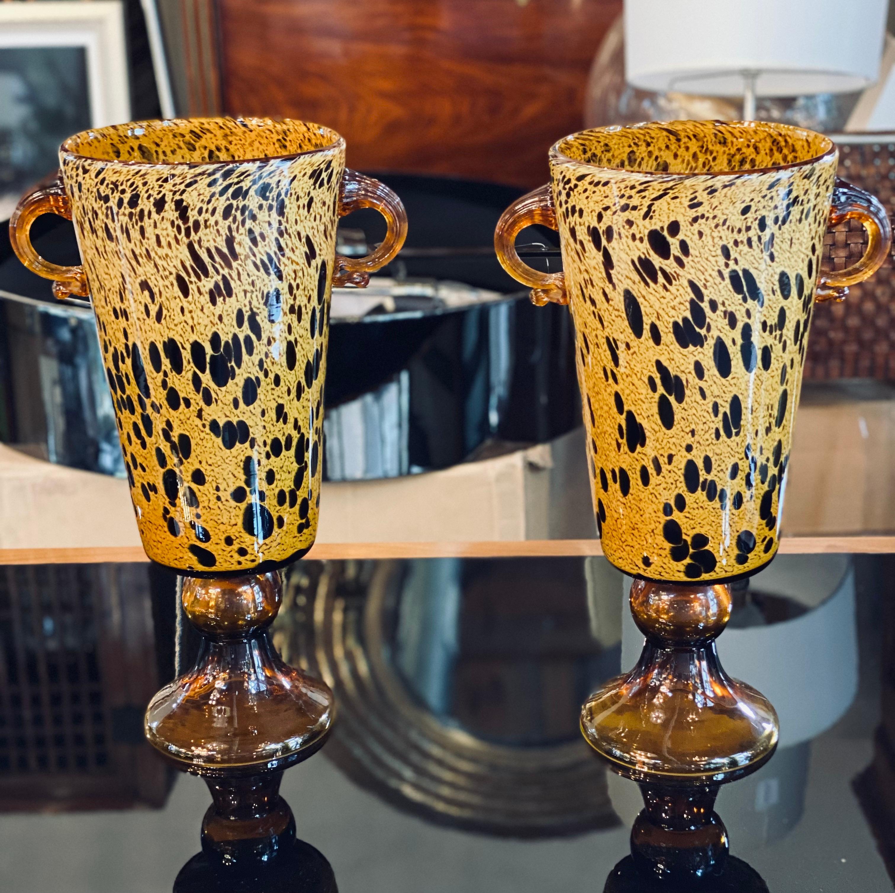 Murano pair of spotted amber vases with hoop handles

11